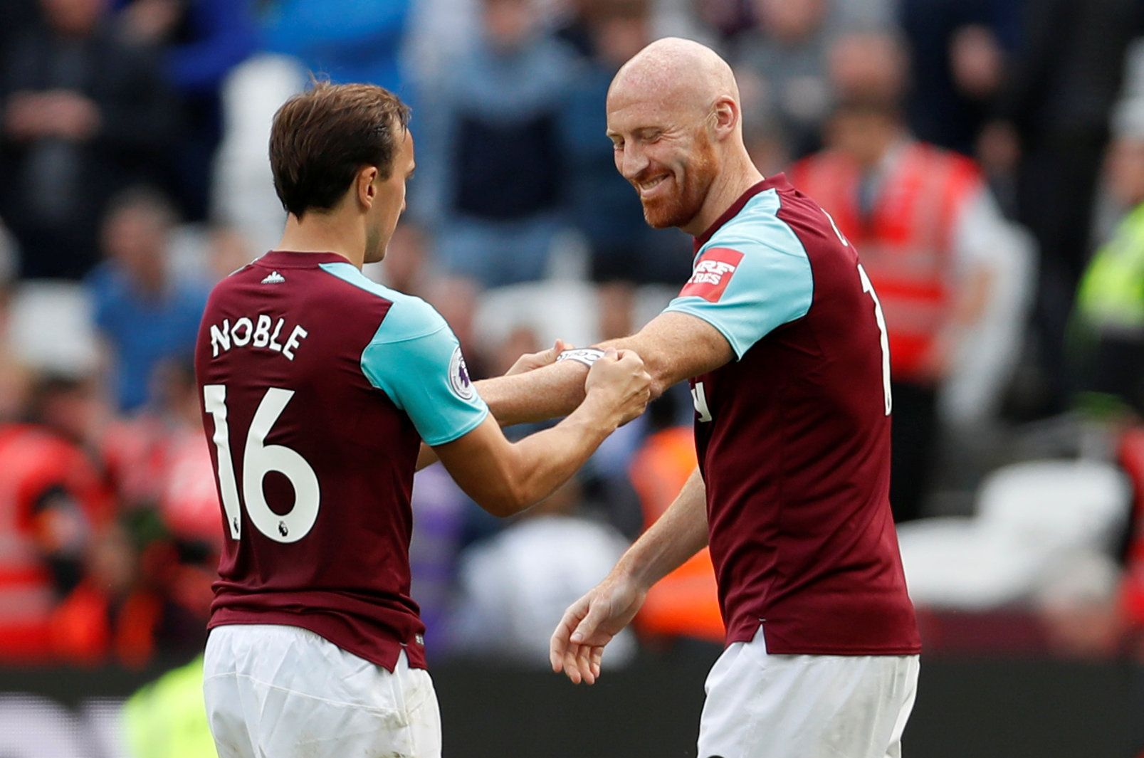 Soccer Football - Premier League - West Ham United vs Everton - London Stadium, London, Britain - May 13, 2018   West Ham United's Mark Noble hands the captain's armband to James Collins    Action Images via Reuters/Paul Childs    EDITORIAL USE ONLY. No use with unauthorized audio, video, data, fixture lists, club/league logos or 