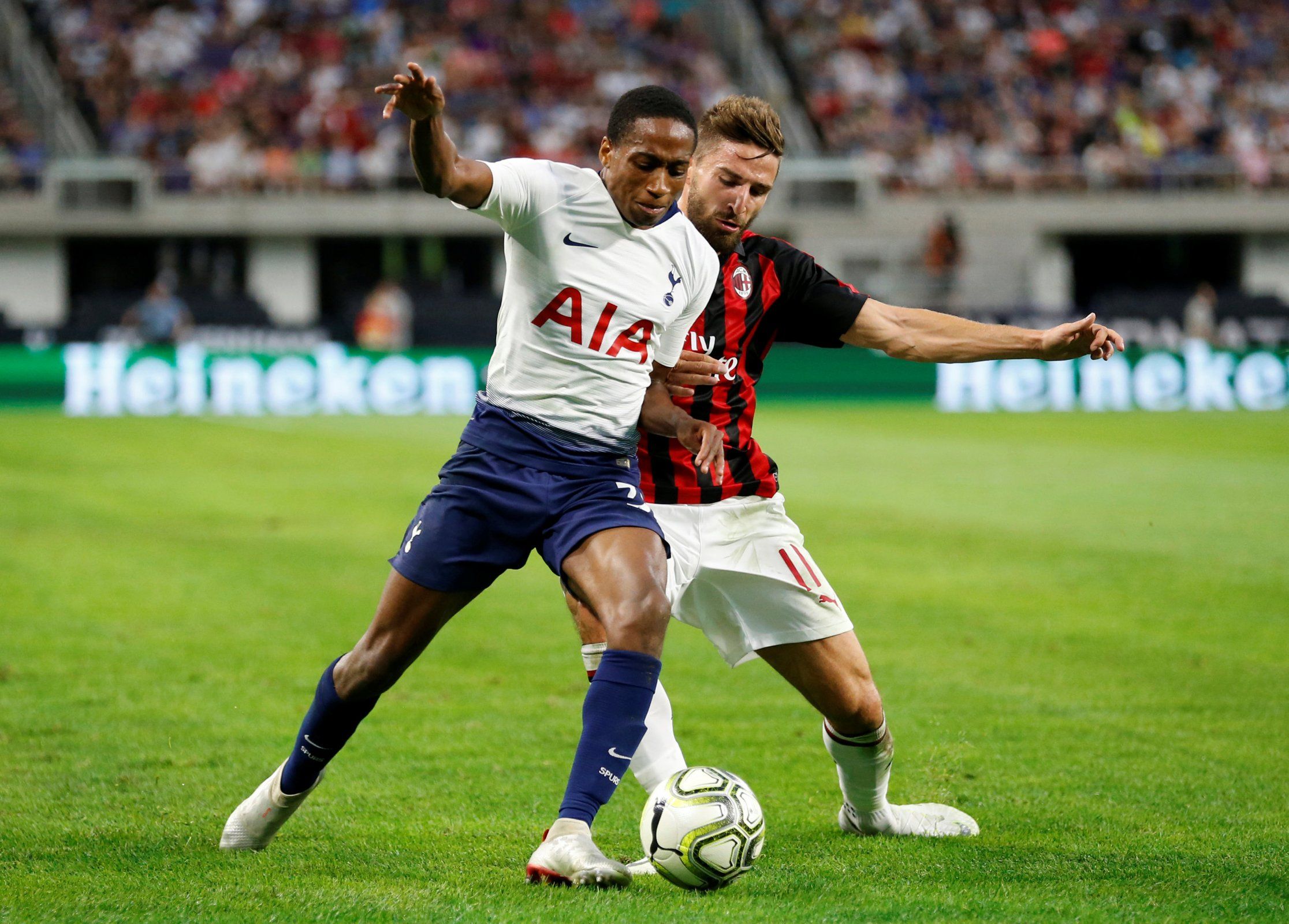 Kyle Walker-Peters battles for the ball