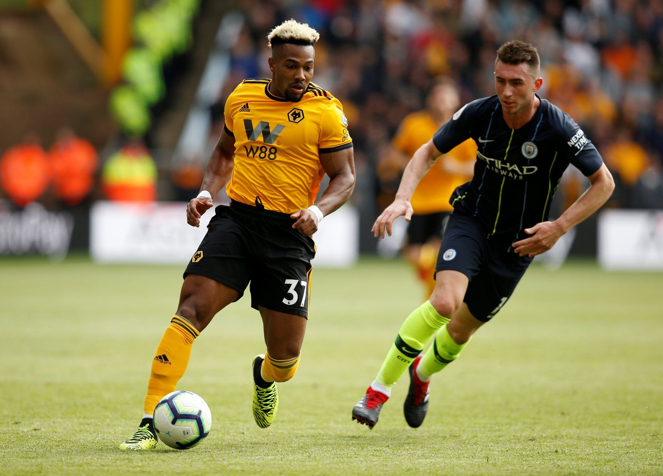 Wolves winger Adama Traore gets away from Man City defender Aymeric Laporte