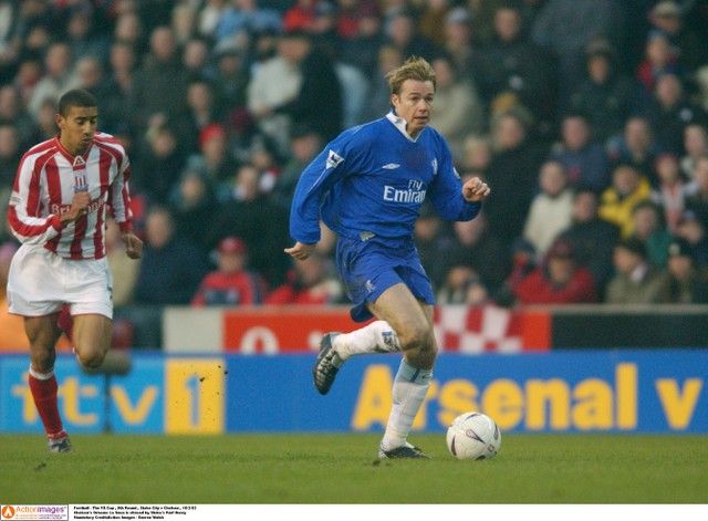 Football - The FA Cup , 5th Round , Stoke City v Chelsea , 16/2/03 
Chelsea's Graeme Le Saux is chased by Stoke's Karl Henry 
Mandatory Credit:Action Images / Darren Walsh
