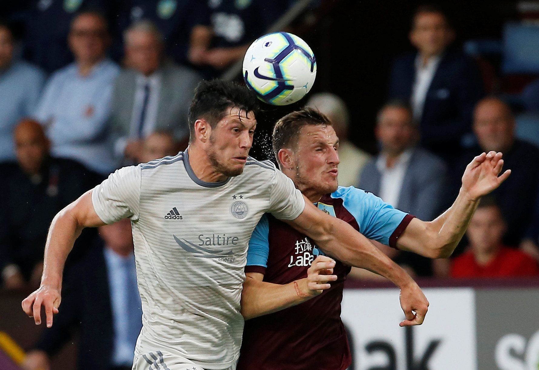 Soccer Football - Europa League - Second Qualifying Round Second Leg - Burnley v Aberdeen - Turf Moor, Burnley, Britain - August 2, 2018   Burnley's Chris Wood in action with Aberdeen's Scott McKenna   Action Images via Reuters/Craig Brough