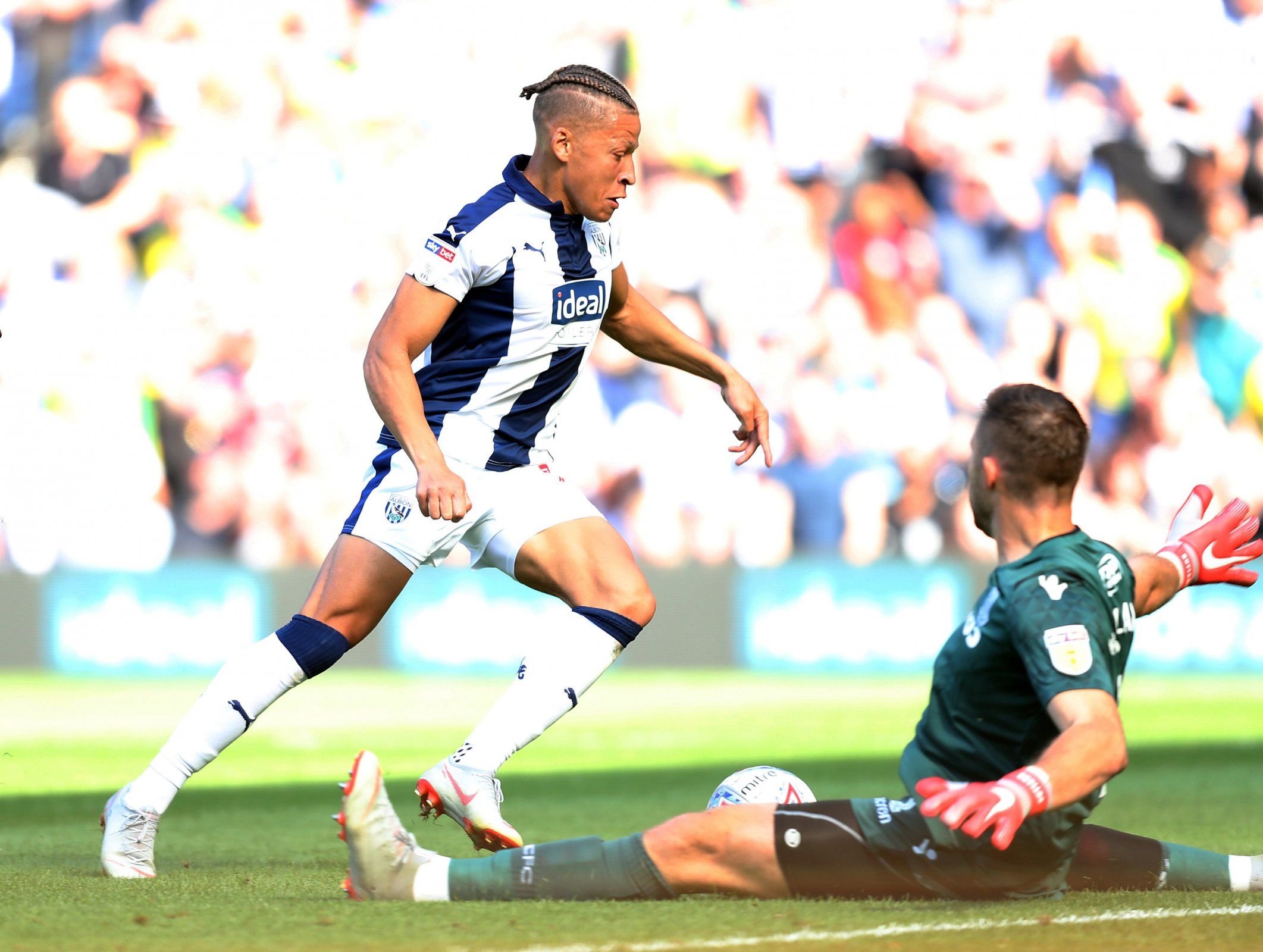 Dwight Gayle runs with the ball during West Bromwich Albion v Stoke City