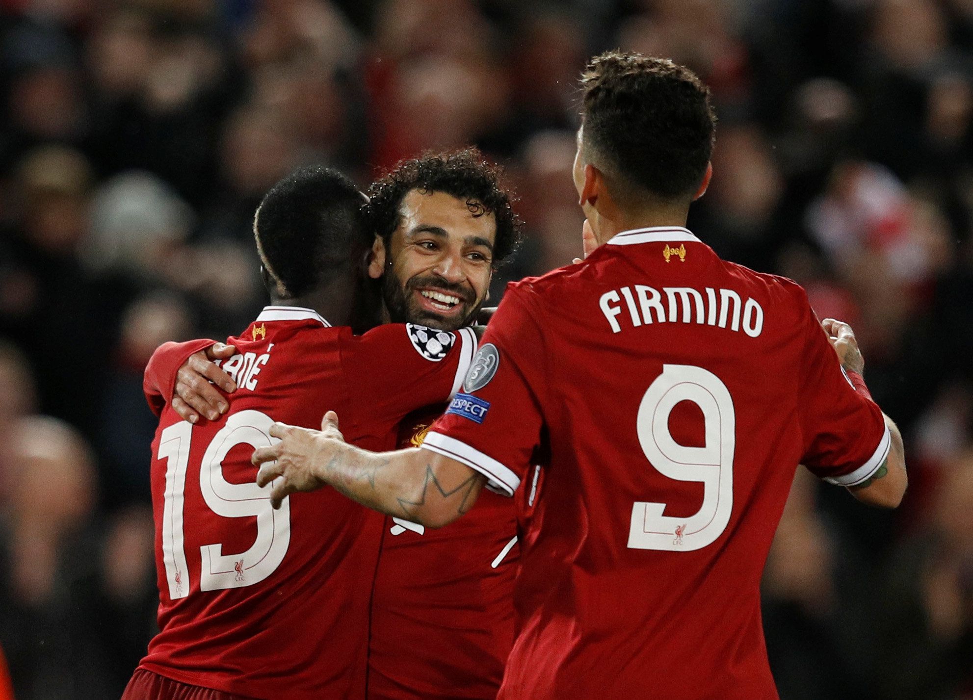 Soccer Football - Champions League Semi Final First Leg - Liverpool vs AS Roma - Anfield, Liverpool, Britain - April 24, 2018   Liverpool's Sadio Mane celebrates scoring their third goal with Mohamed Salah and Roberto Firmino    REUTERS/Phil Noble