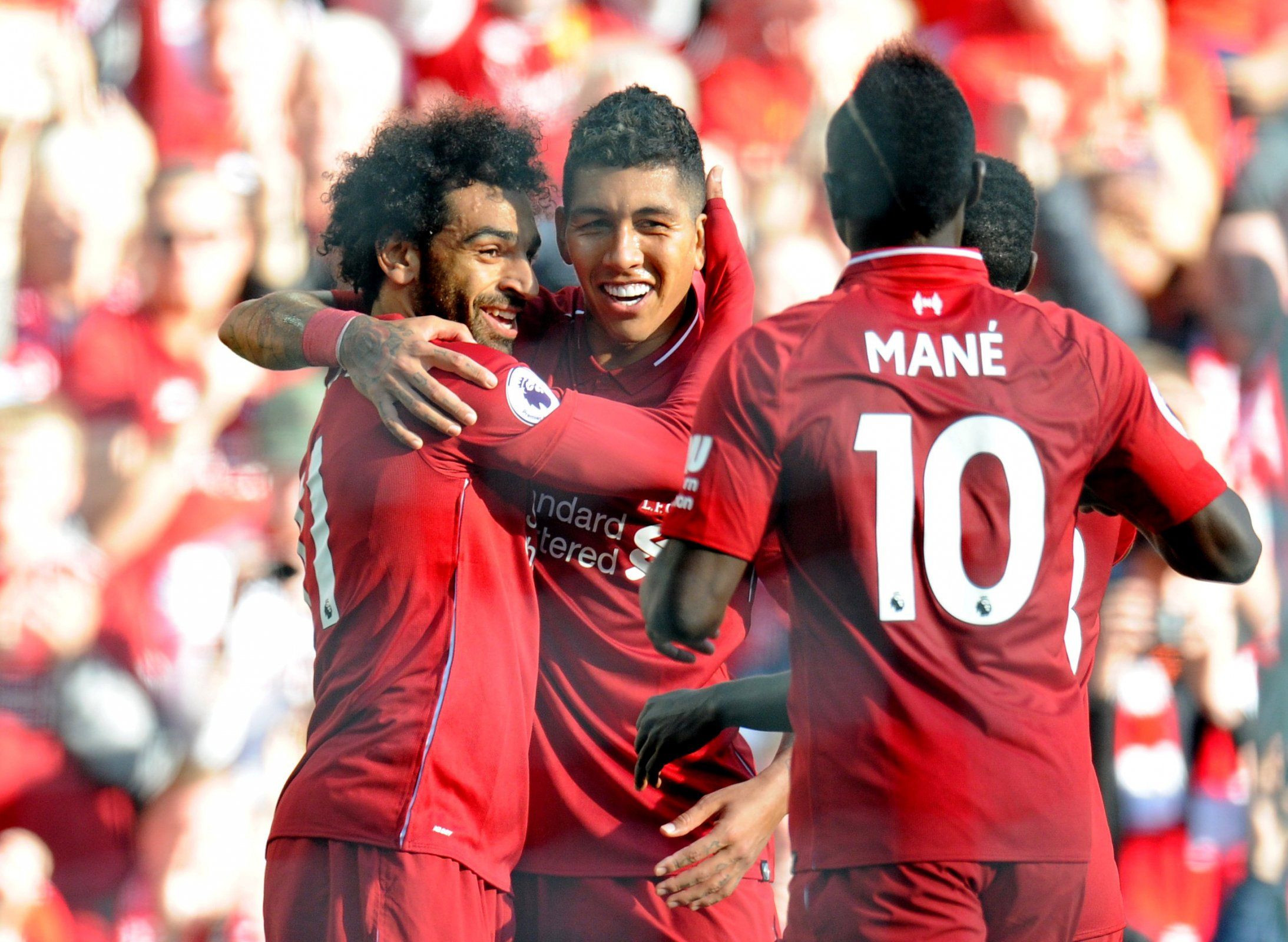 Mohamed Salah, Sadio Mane and Roberto Firmino celebrate scoring