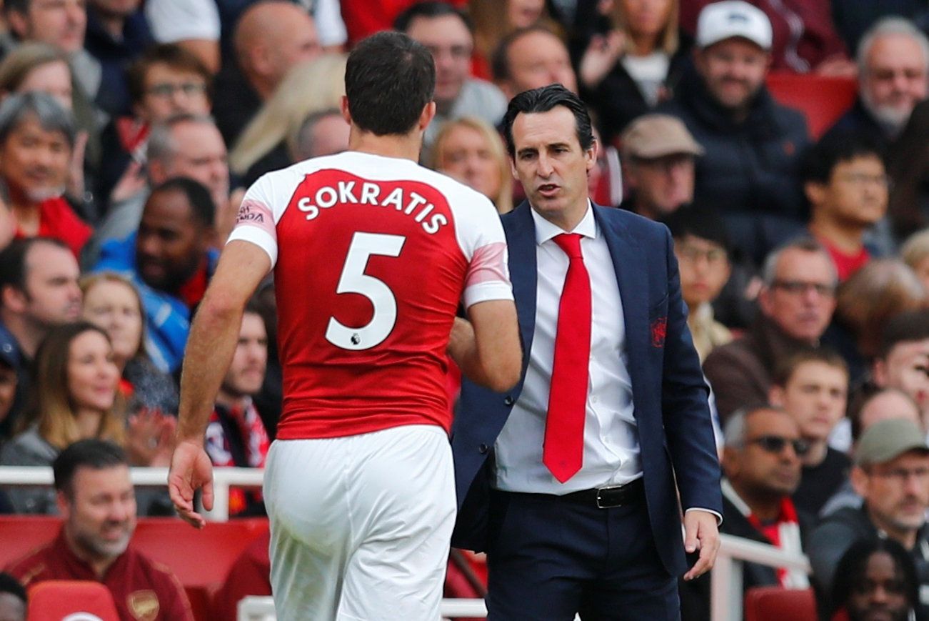 Soccer Football - Premier League - Arsenal v Everton - Emirates Stadium, London, Britain - September 23, 2018  Arsenal's Sokratis Papastathopoulos with manager Unai Emery   REUTERS/Eddie Keogh  EDITORIAL USE ONLY. No use with unauthorized audio, video, data, fixture lists, club/league logos or 