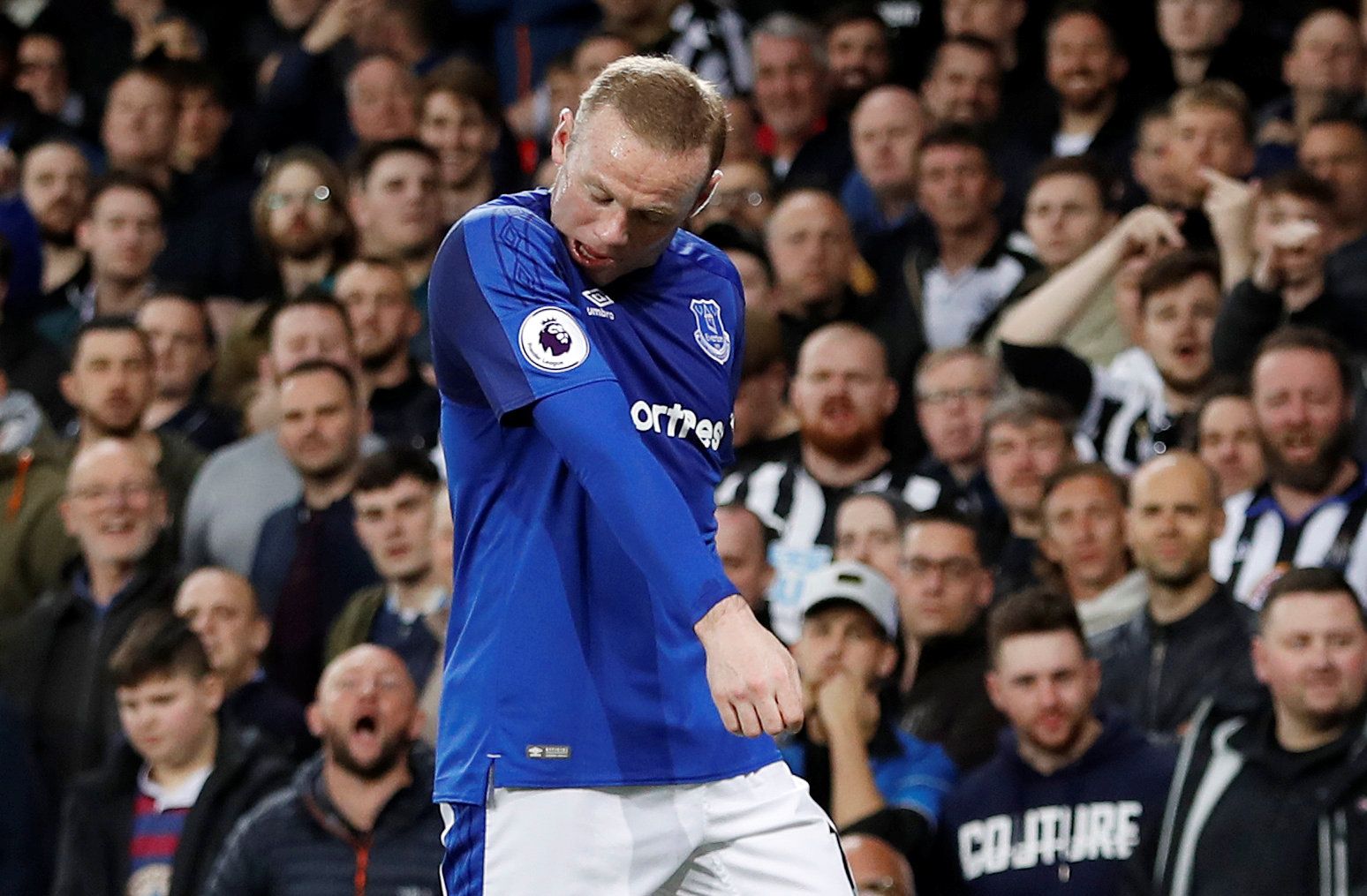 Soccer Football - Premier League - Everton v Newcastle United - Goodison Park, Liverpool, Britain - April 23, 2018   Newcastle United fans and Everton's Wayne Rooney     Action Images via Reuters/Lee Smith    EDITORIAL USE ONLY. No use with unauthorized audio, video, data, fixture lists, club/league logos or 