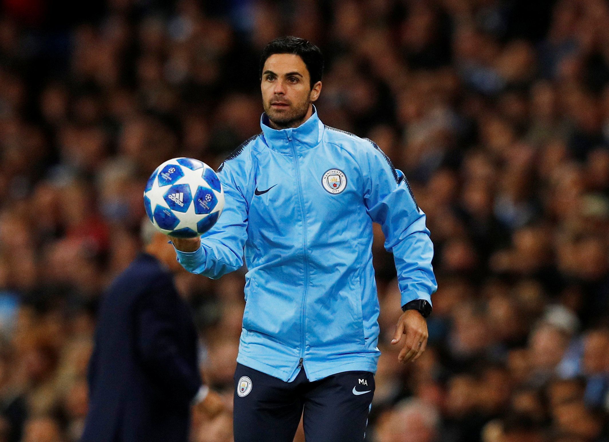 Soccer Football - Champions League - Group Stage - Group F - Manchester City v Olympique Lyonnais - Etihad Stadium, Manchester, Britain - September 19, 2018  Manchester City co assistant coach Mikel Arteta gathers the ball during the match  REUTERS/Phil Noble