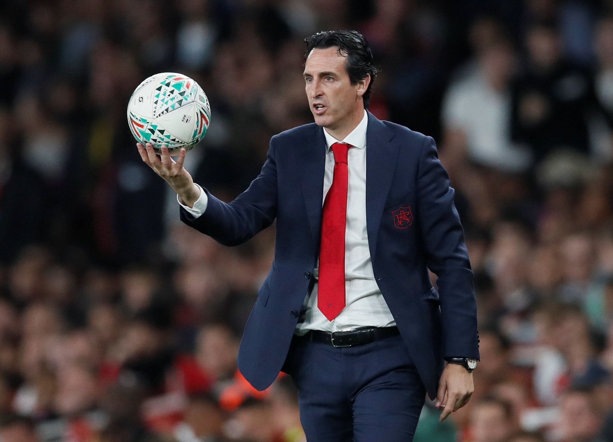 Arsenal manager Unai Emery holds the ball during Carabao Cup win over Brentford