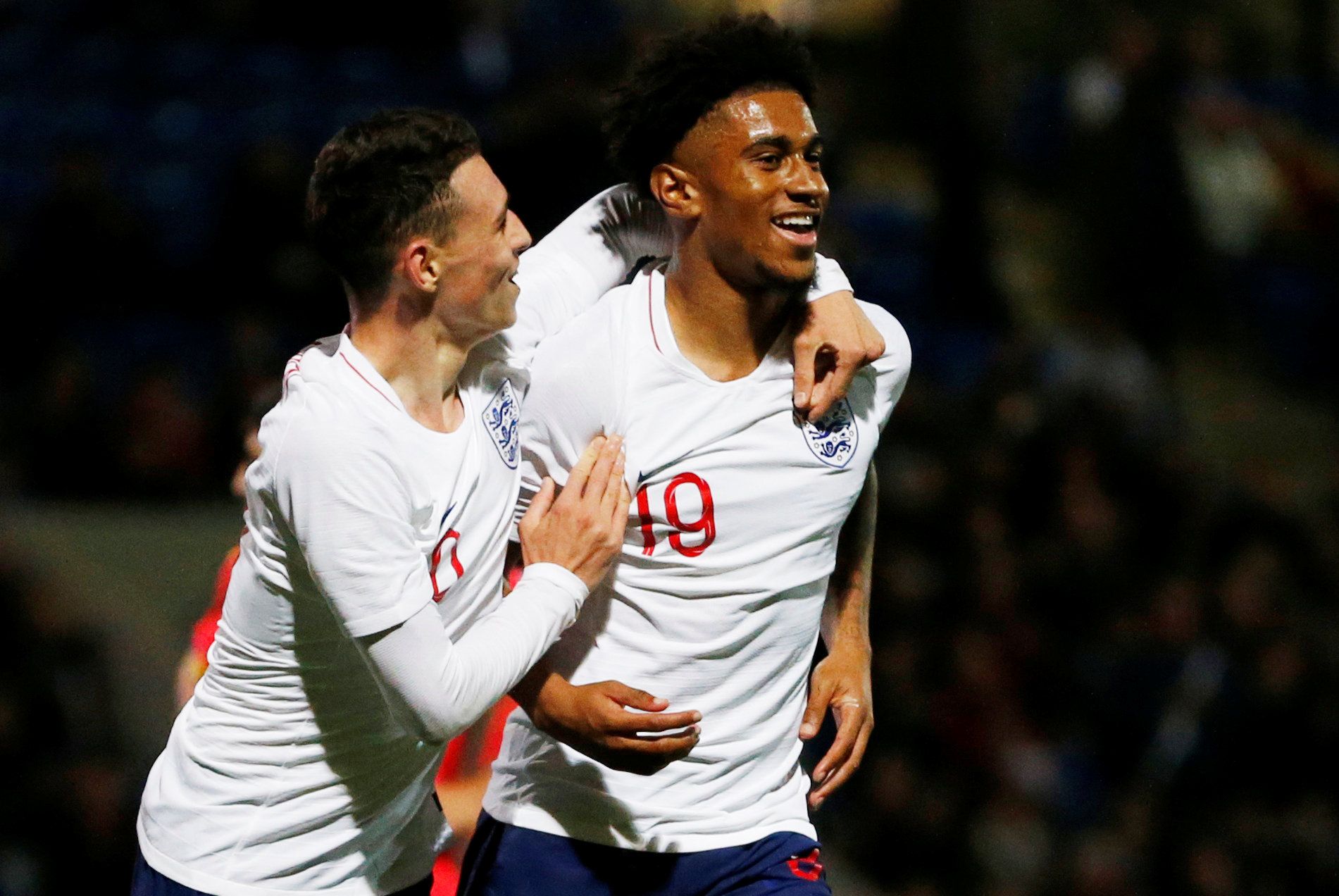 Soccer Football - European Under 21 Championship Qualifier - Group 4 - England v Andorra - Proact Stadium, Chesterfield, Britain - October 11, 2018  England's Reiss Nelson celebrates scoring their sixth goal with Phil Foden  Action Images/Ed Sykes