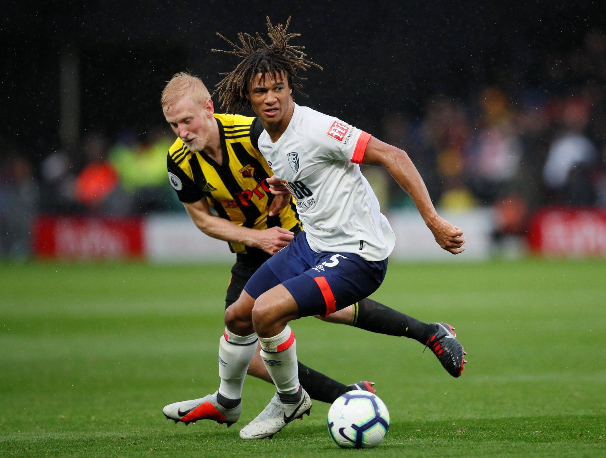 Bournemouth defender Nathan Ake in action with Watford's Will Hughes
