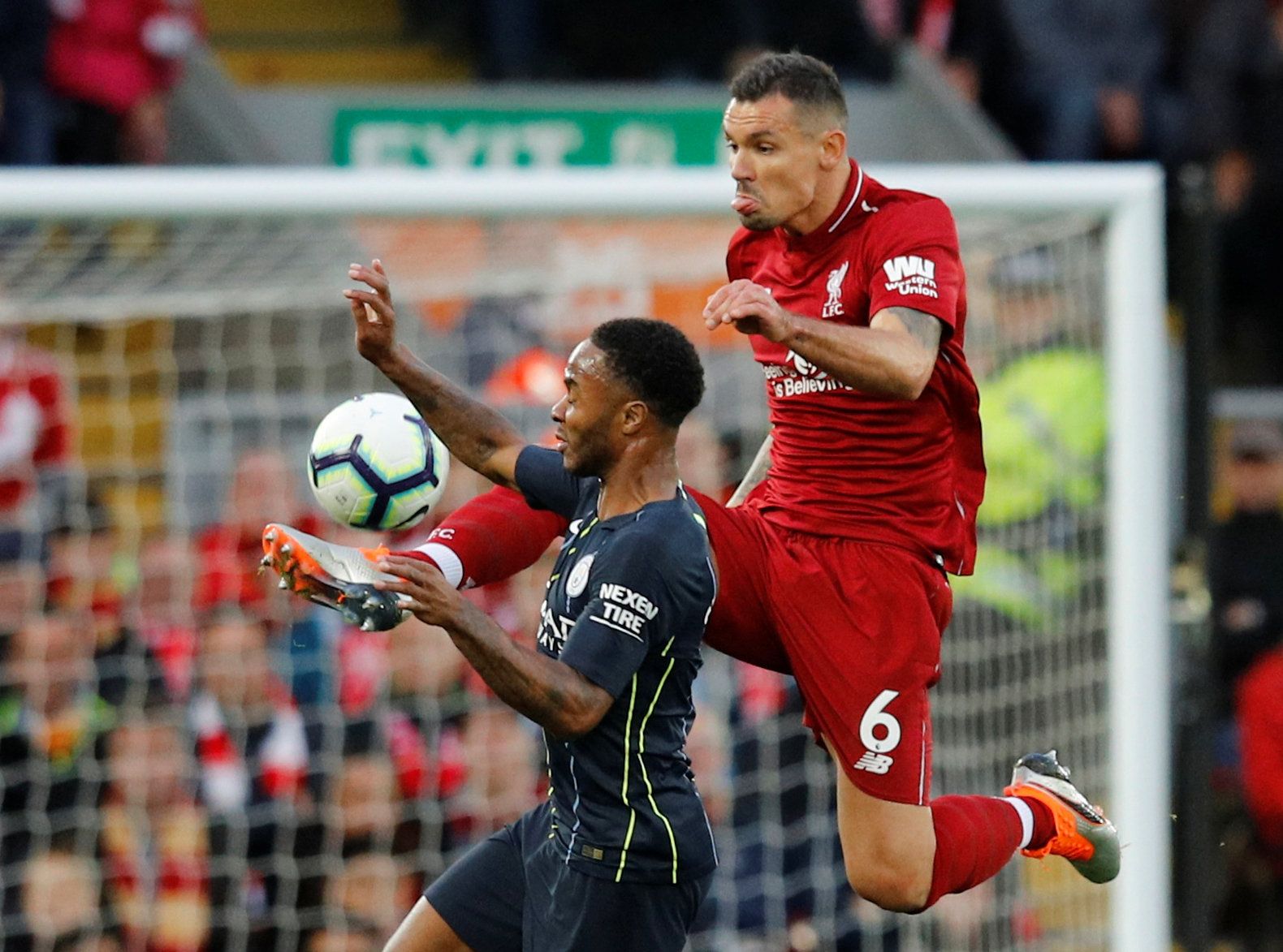 Soccer Football - Premier League - Liverpool v Manchester City - Anfield, Liverpool, Britain - October 7, 2018  Manchester City's Raheem Sterling in action with Liverpool's Dejan Lovren                   REUTERS/Phil Noble  EDITORIAL USE ONLY. No use with unauthorized audio, video, data, fixture lists, club/league logos or 