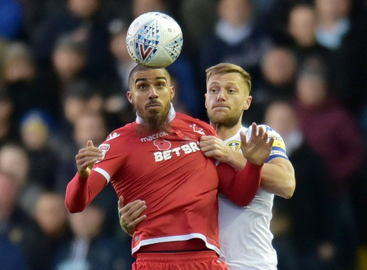 Soccer Football - Championship - Leeds United v Nottingham Forest - Elland Road, Leeds, Britain - October 27, 2018   Leeds United's Liam Cooper in action with Nottingham Forest's Lewis Grabban   Action Images/Paul Burrows    EDITORIAL USE ONLY. No use with unauthorized audio, video, data, fixture lists, club/league logos or 