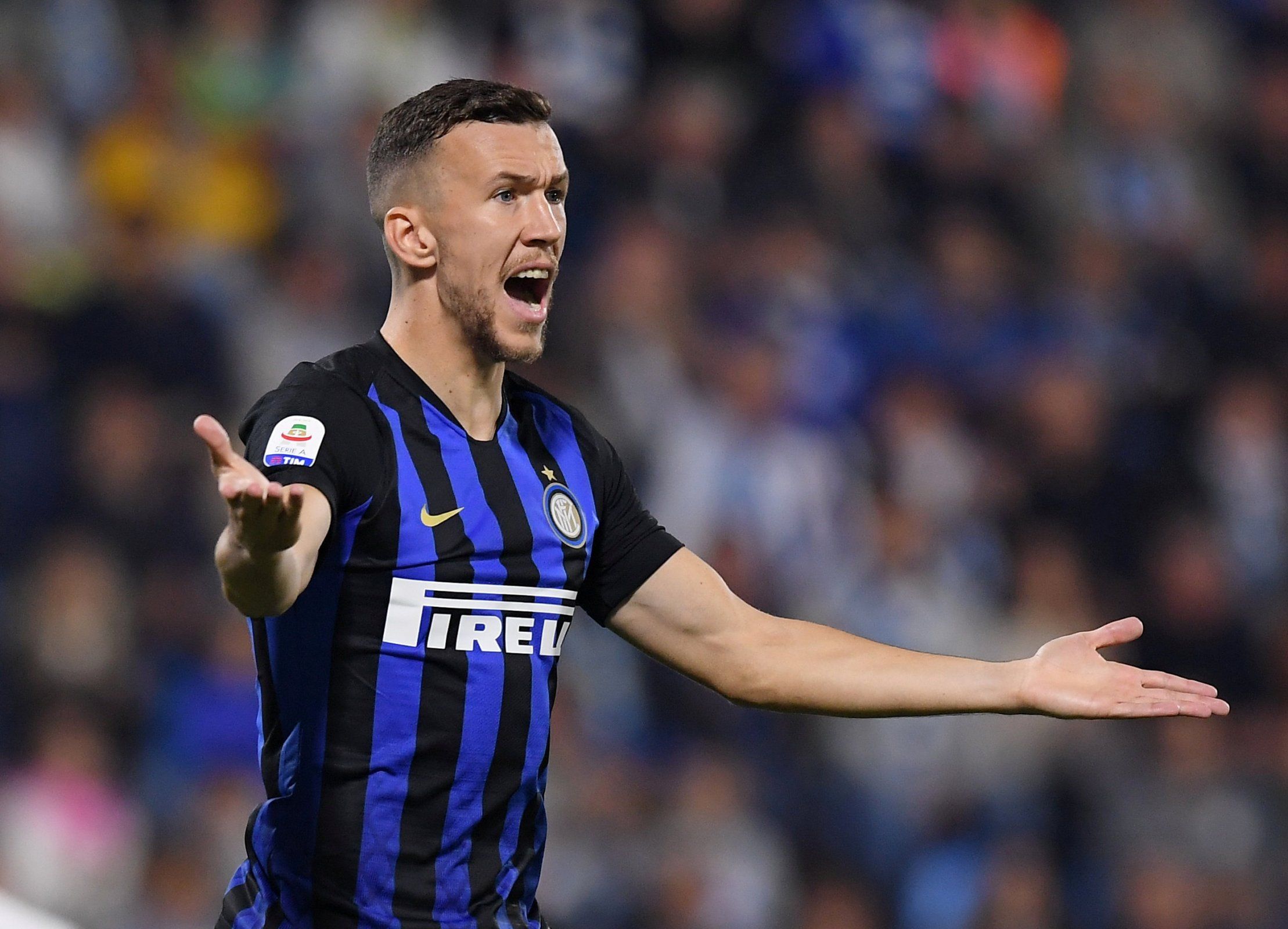Ivan Perisic protests to the referee