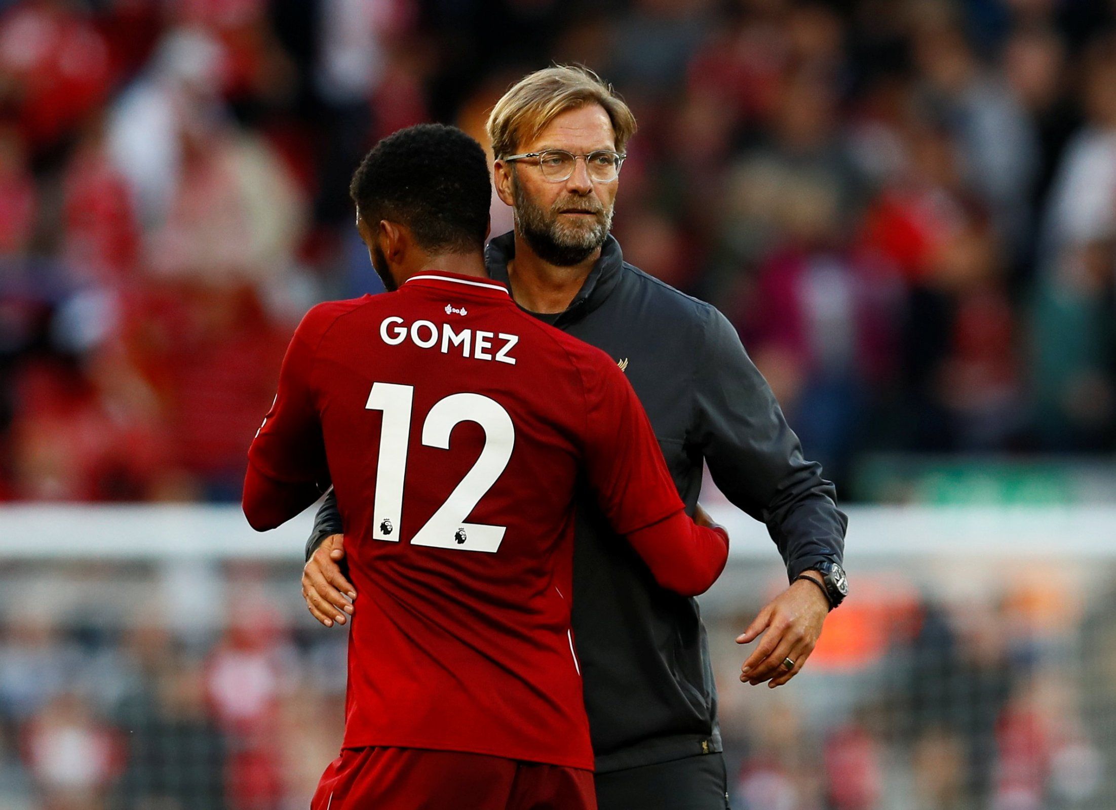 Liverpool manager Jurgen Klopp embraces Joe Gomez