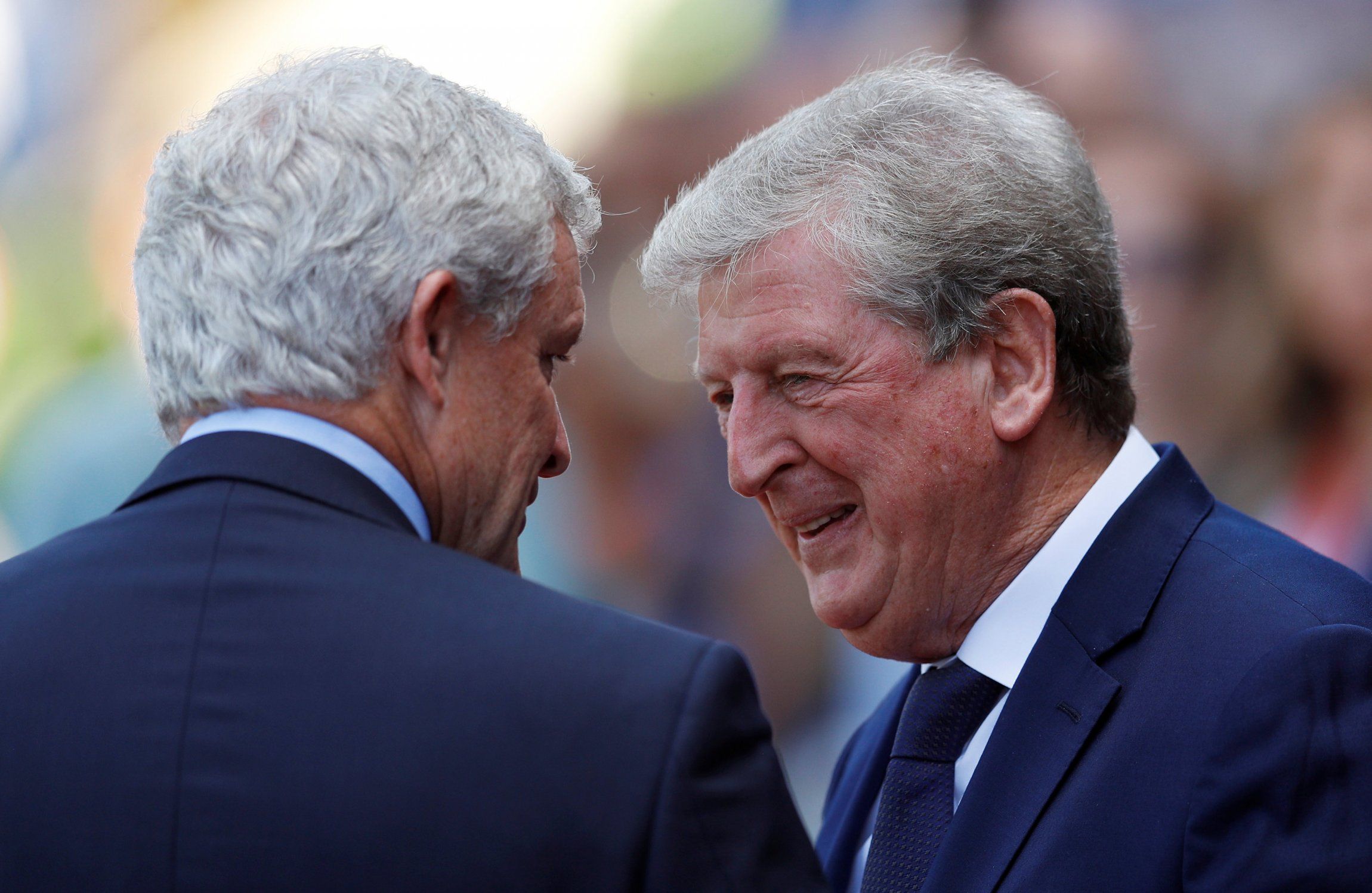 Mark Hughes and Roy Hodgson share a joke