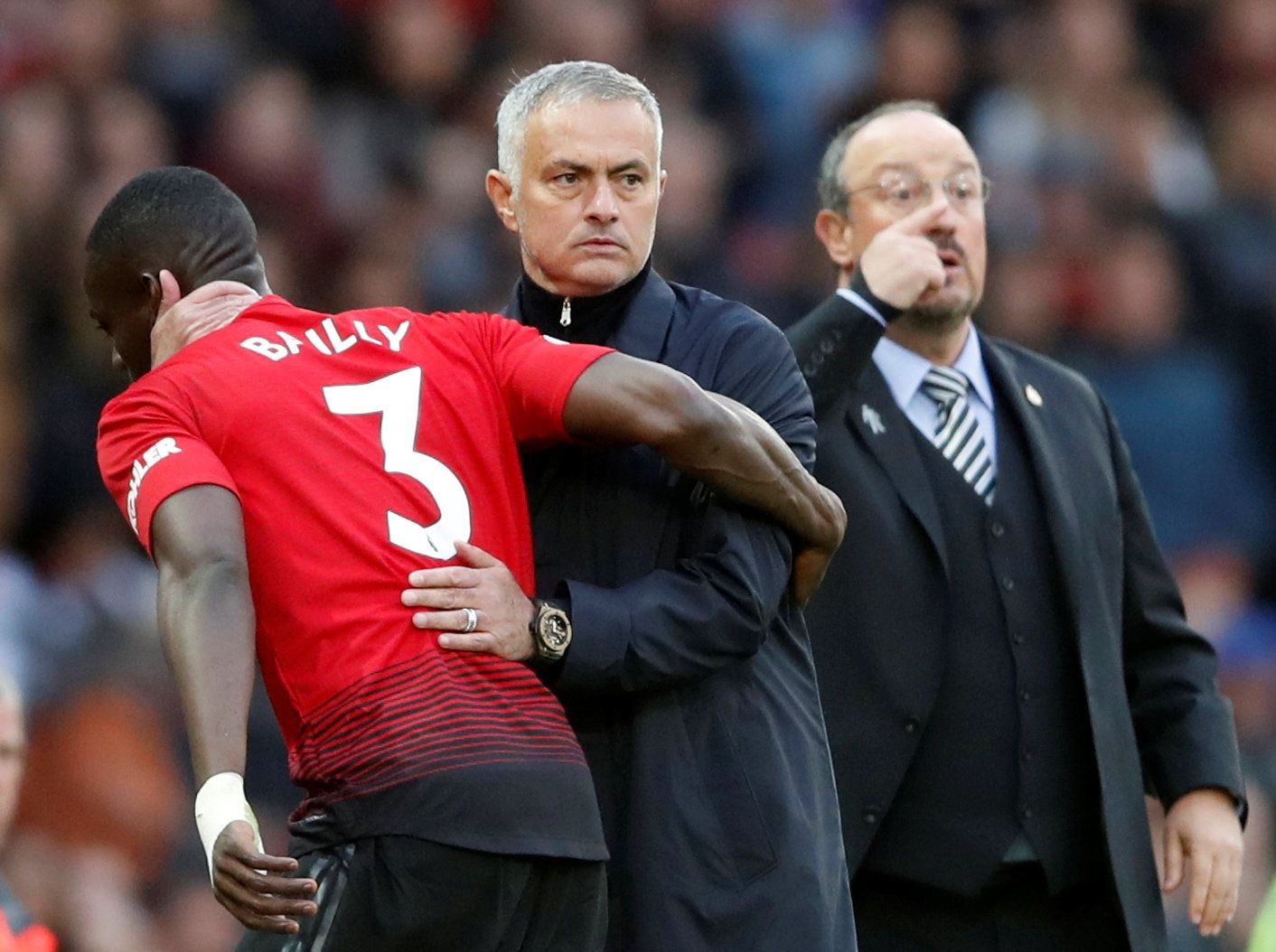Soccer Football - Premier League - Manchester United v Newcastle United - Old Trafford, Manchester, Britain - October 6, 2018  Manchester United's Eric Bailly with manager Jose Mourinho after being substituted off  Action Images via Reuters/Carl Recine  EDITORIAL USE ONLY. No use with unauthorized audio, video, data, fixture lists, club/league logos or 