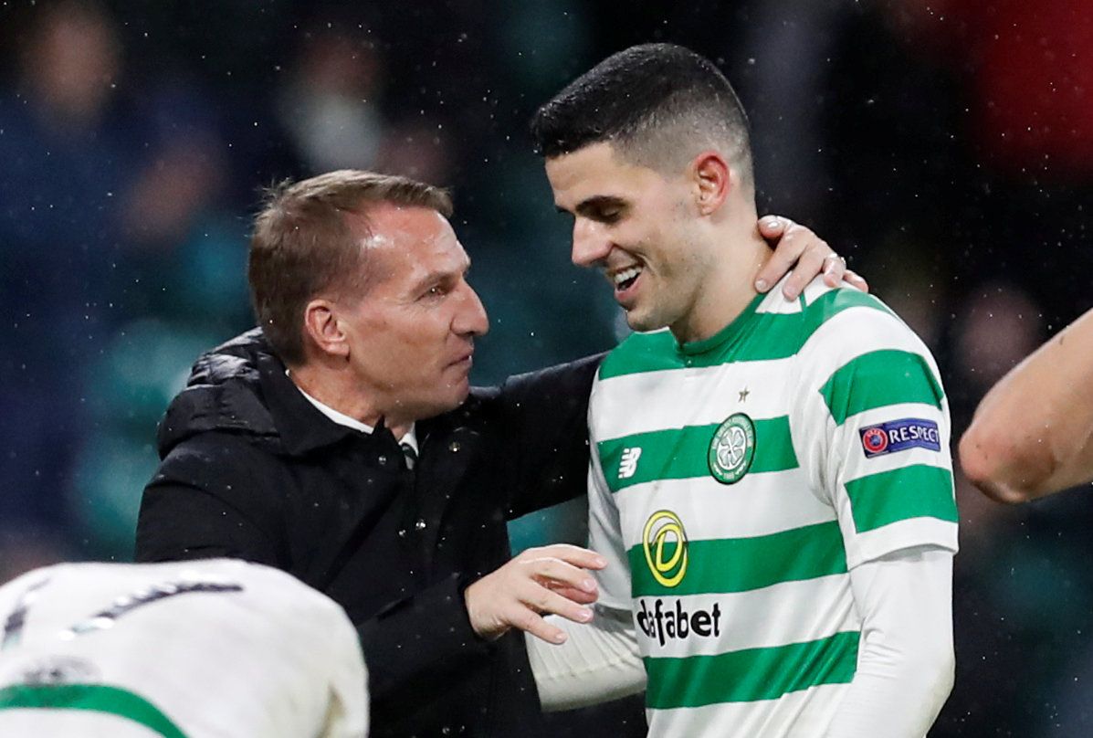 Soccer Football - Europa League - Group Stage - Group B - Celtic v RB Leipzig - Celtic Park, Glasgow, Britain - November 8, 2018  Celtic's Tom Rogic celebrates with manager Brendan Rodgers after the match   REUTERS/Russell Cheyne