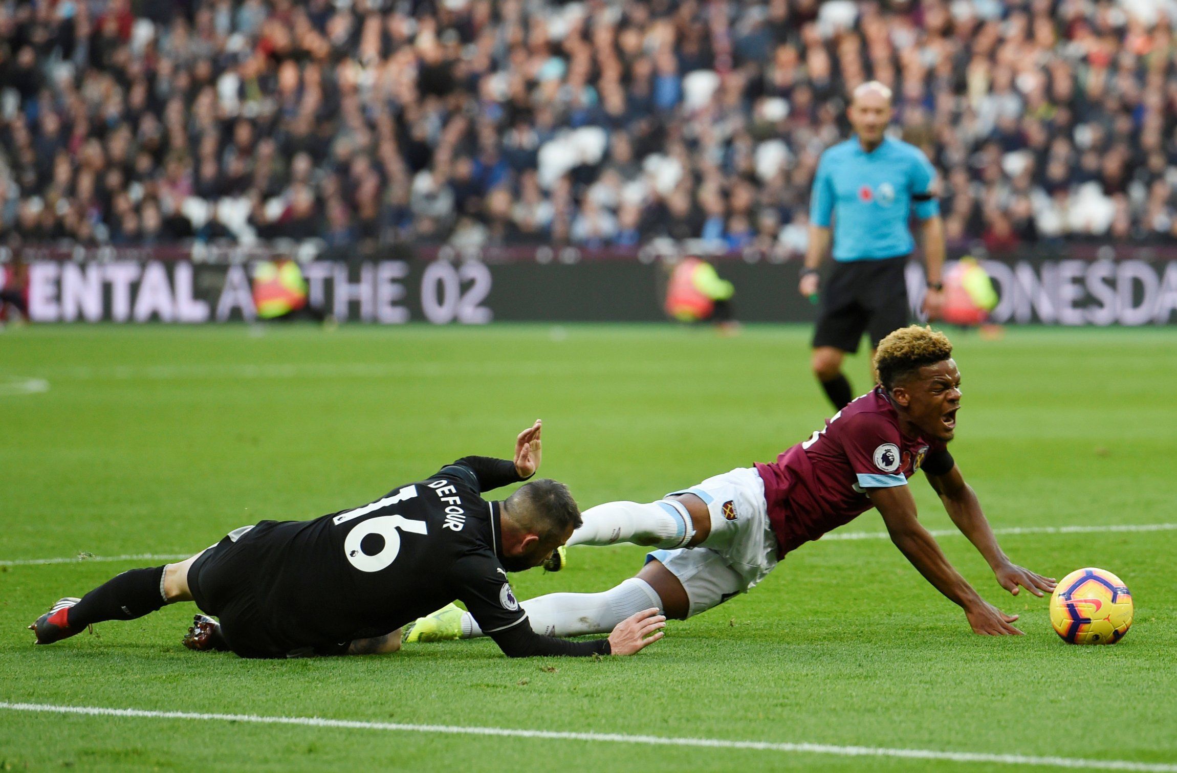 Grady Diangana brought down by Steven Defour v Burnley