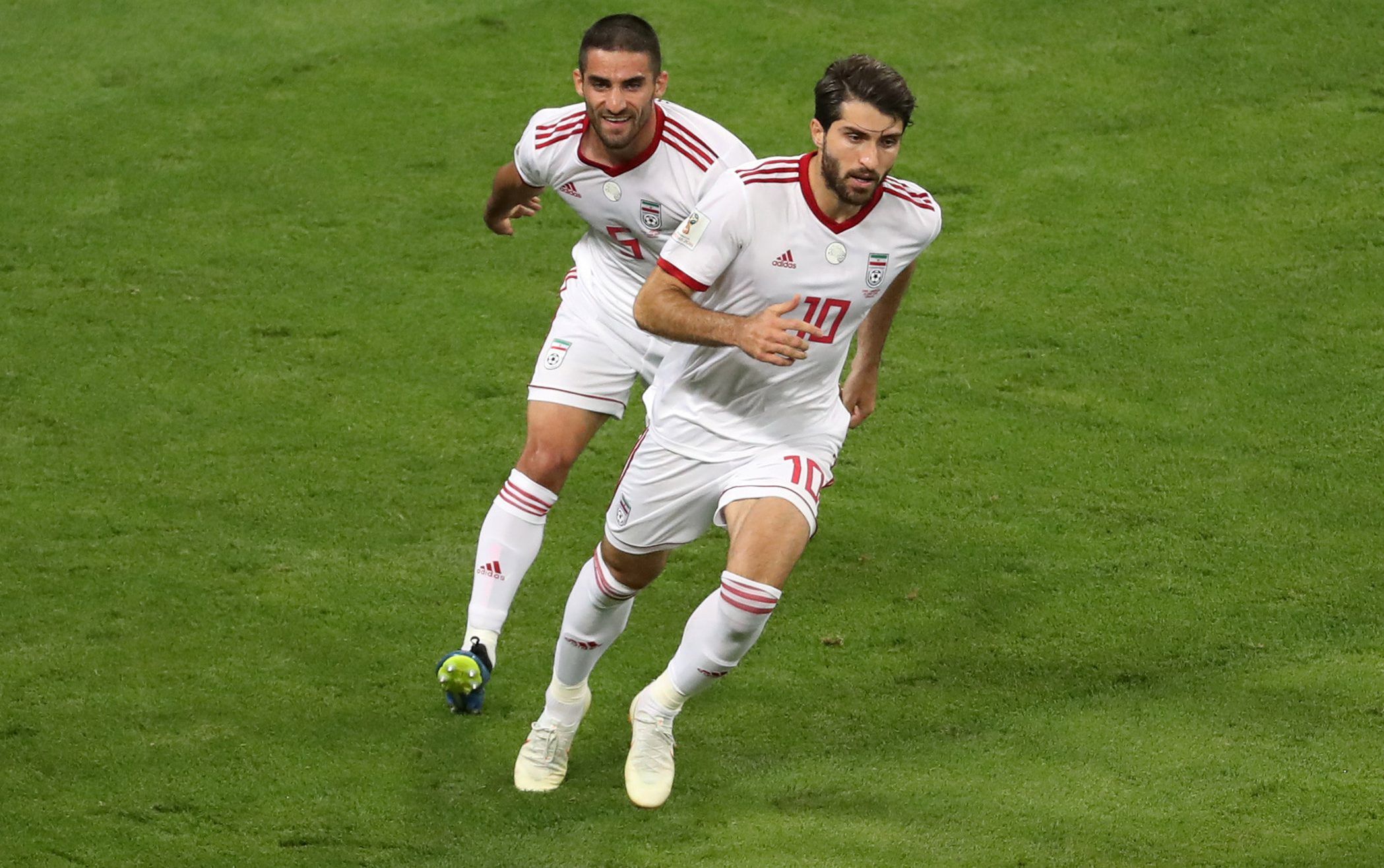 Soccer Football - World Cup - Group B - Iran vs Portugal - Mordovia Arena, Saransk, Russia - June 25, 2018   Iran's Karim Ansarifard celebrates scoring their first goal with Milad Mohammadi    REUTERS/Lucy Nicholson