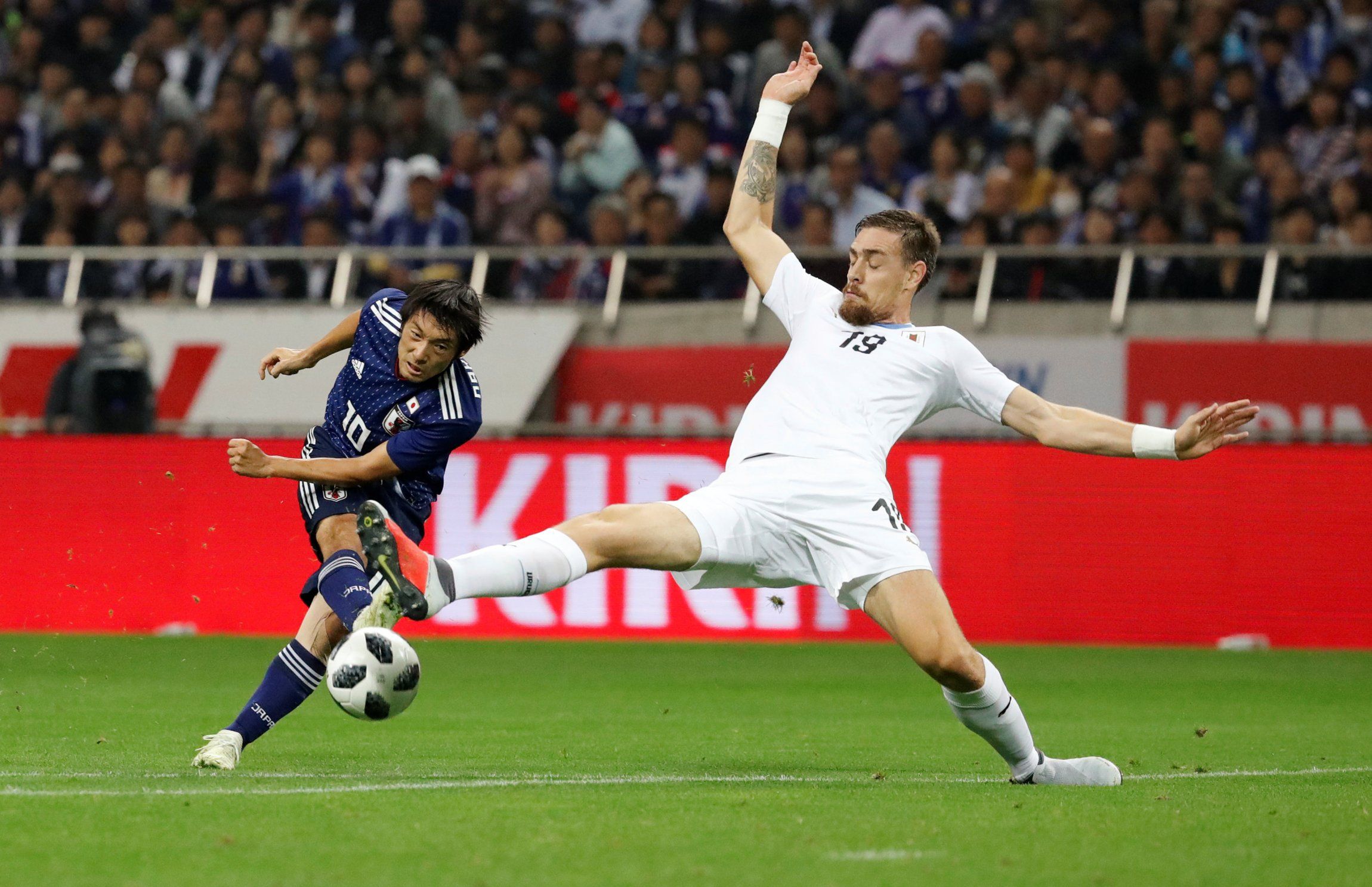 Japan's Shoya Nakajima shoots at goal vs Uruguay