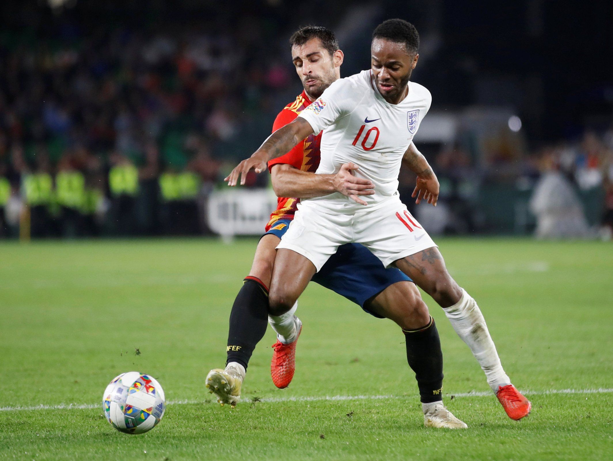 Raheem Sterling holds off a challenge