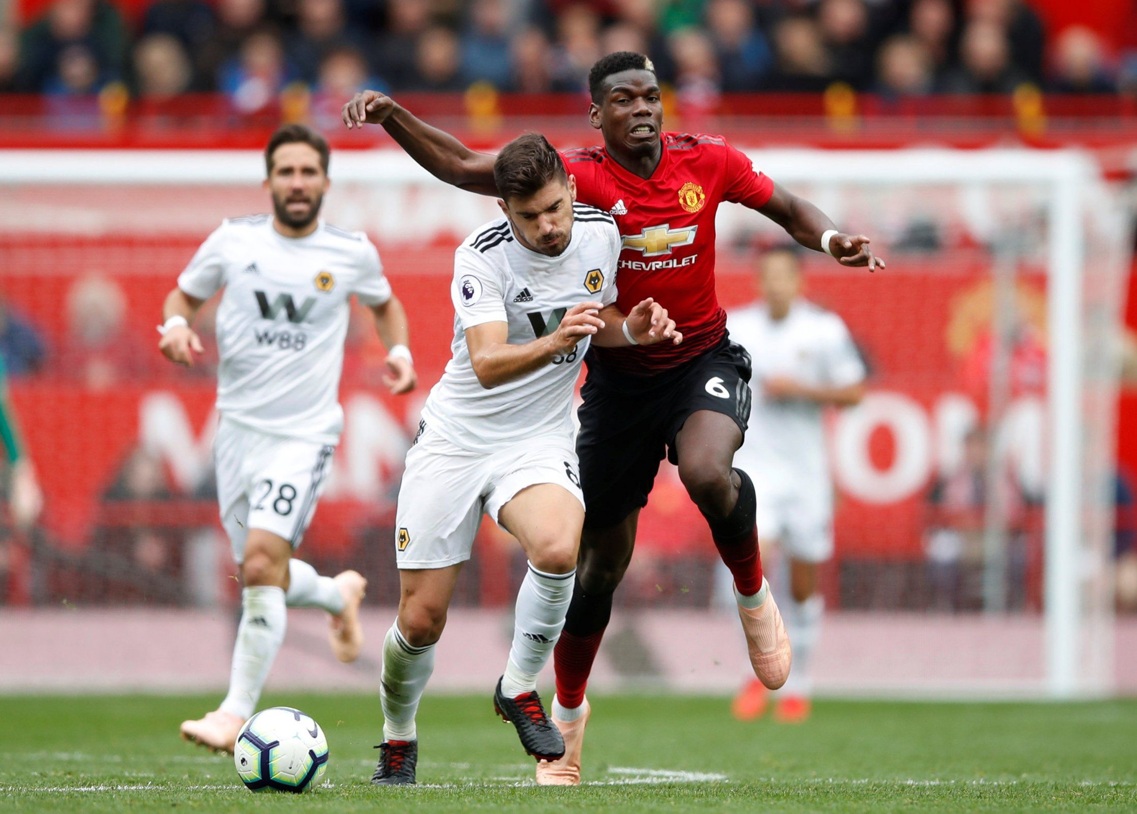Wolverhampton Wanderers' Ruben Neves slams Manchester United's Paul Pogba to the side