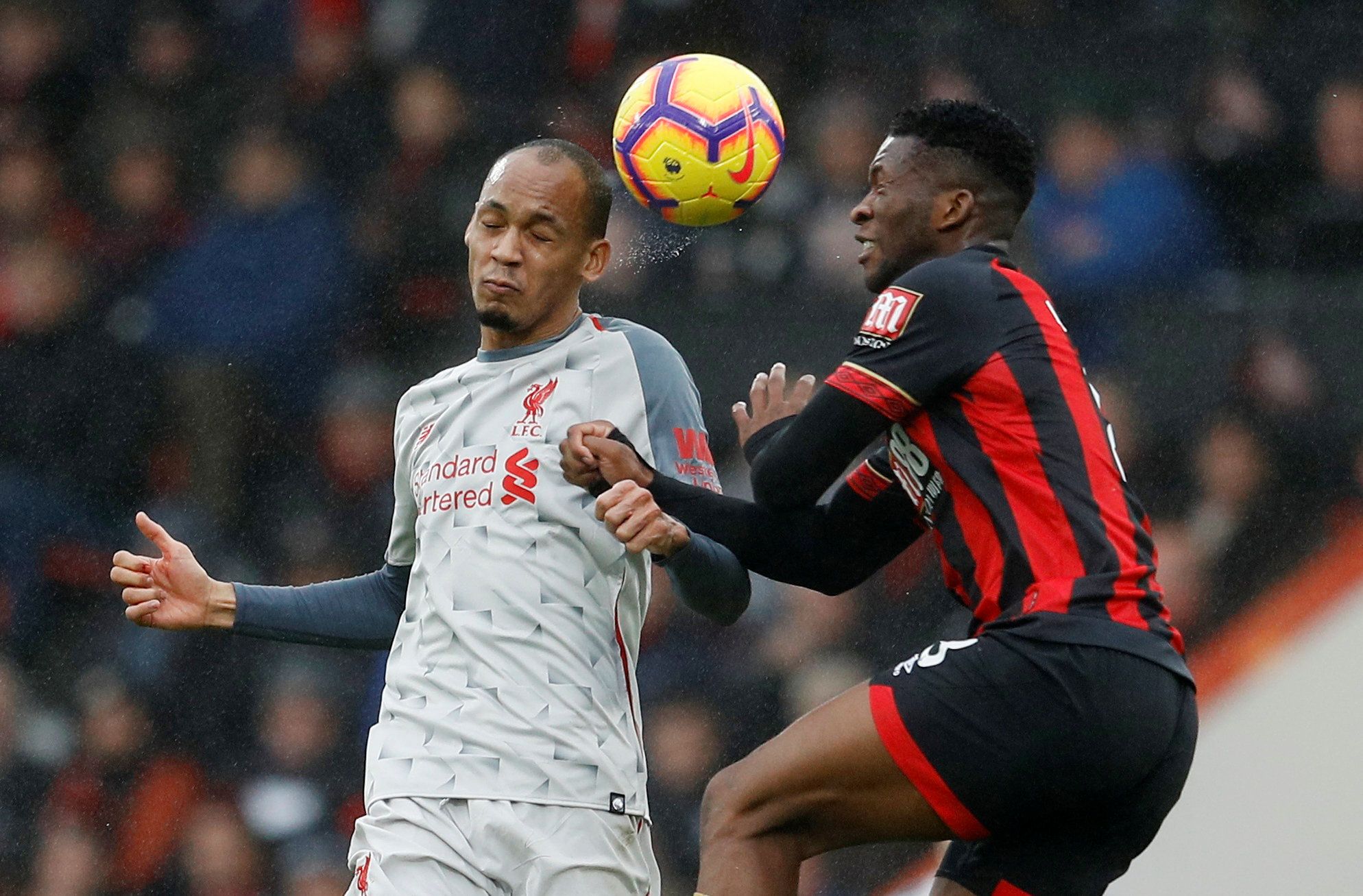 Soccer Football - Premier League - AFC Bournemouth v Liverpool - Vitality Stadium, Bournemouth, Britain - December 8, 2018  Liverpool's Fabinho in action with Bournemouth's Jefferson Lerma   REUTERS/Peter Nicholls  EDITORIAL USE ONLY. No use with unauthorized audio, video, data, fixture lists, club/league logos or 