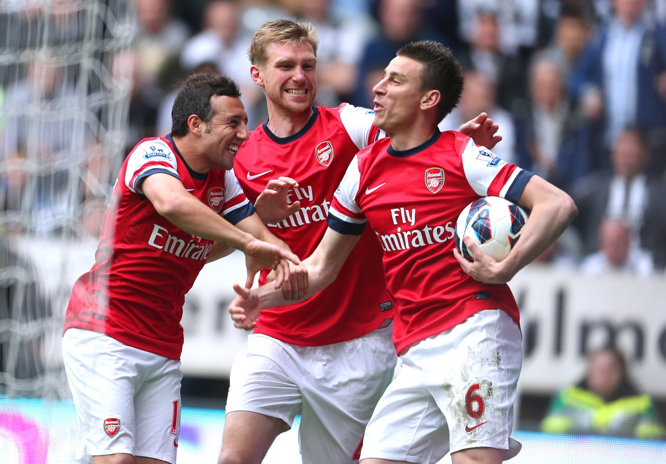 Laurent Koscielny celebrates scoring Arsenal's goal vs Newcastle with Santi Cazorla and Per Mertesacker