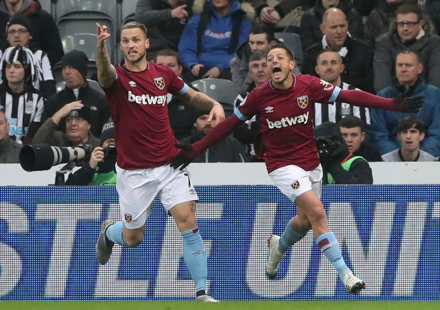 Soccer Football - Premier League - Newcastle United v West Ham United - St James' Park, Newcastle, Britain - December 1, 2018  West Ham's Javier Hernandez celebrates scoring their first goal with Marko Arnautovic   REUTERS/Scott Heppell  EDITORIAL USE ONLY. No use with unauthorized audio, video, data, fixture lists, club/league logos or "live" services. Online in-match use limited to 75 images, no video emulation. No use in betting, games or single club/league/player publications.  Please contac