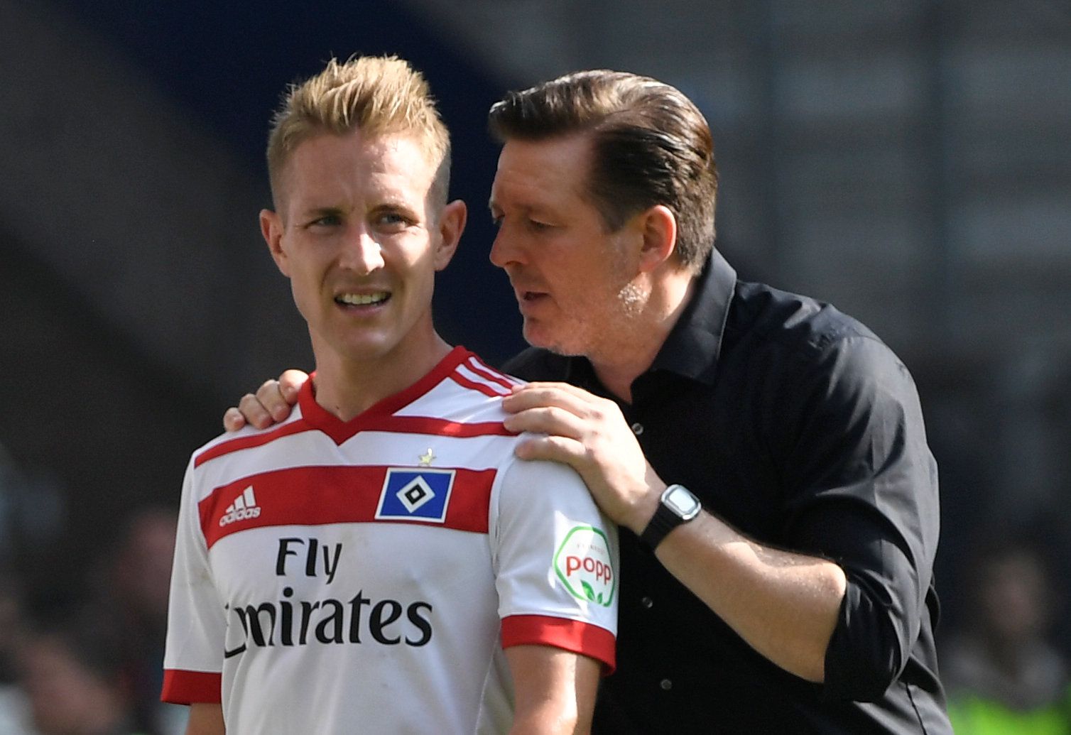 Soccer Football - Bundesliga - Hamburger SV v Borussia Moenchengladbach - Volksparkstadion, Hamburg, Germany - May 12, 2018   Hamburg's Lewis Holtby with coach Christian Titz after being substituted off   REUTERS/Fabian Bimmer    DFL RULES TO LIMIT THE ONLINE USAGE DURING MATCH TIME TO 15 PICTURES PER GAME. IMAGE SEQUENCES TO SIMULATE VIDEO IS NOT ALLOWED AT ANY TIME. FOR FURTHER QUERIES PLEASE CONTACT DFL DIRECTLY AT + 49 69 650050