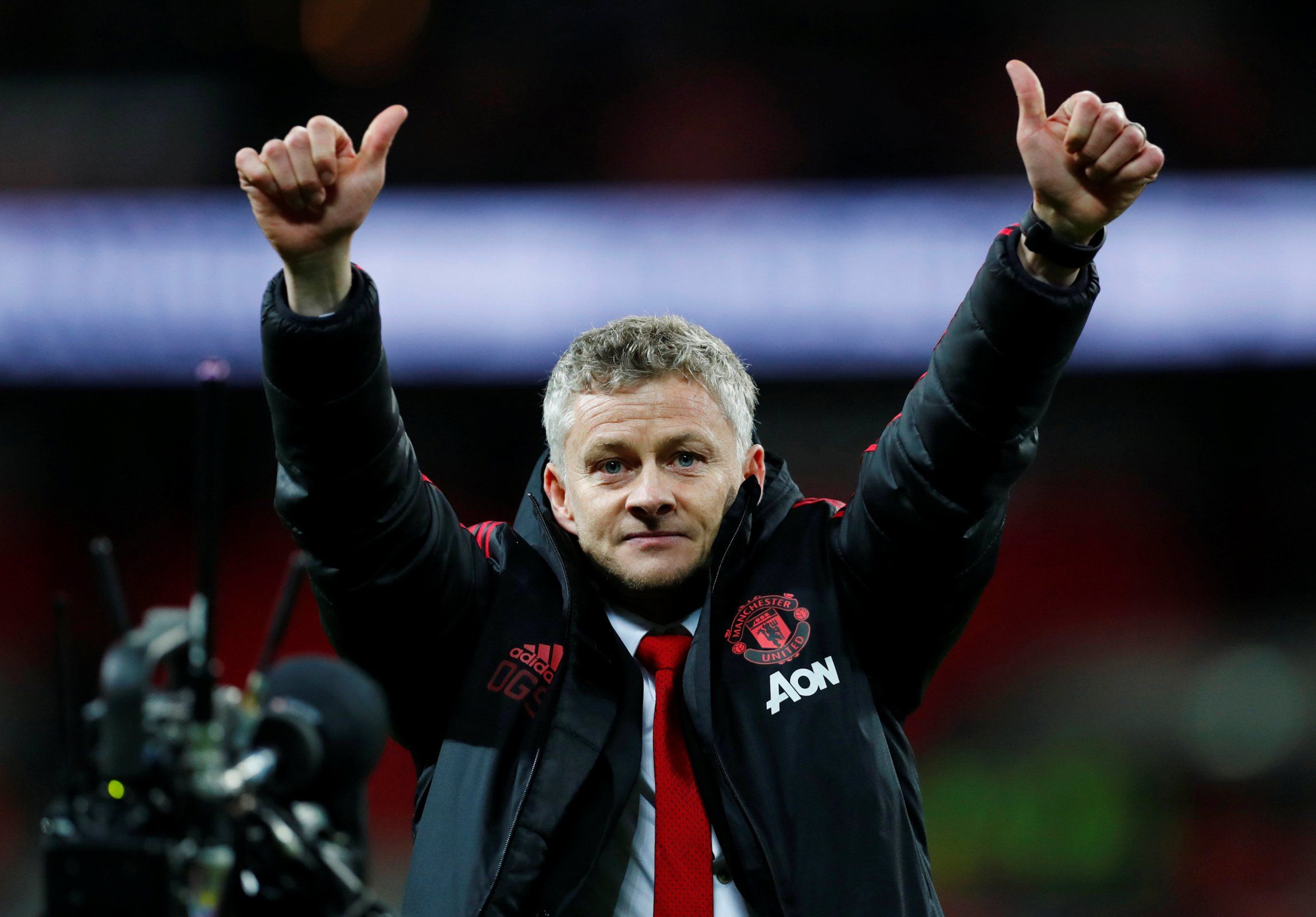 Ole Gunnar Solskjaer with his thumbs up to Manchester United fan