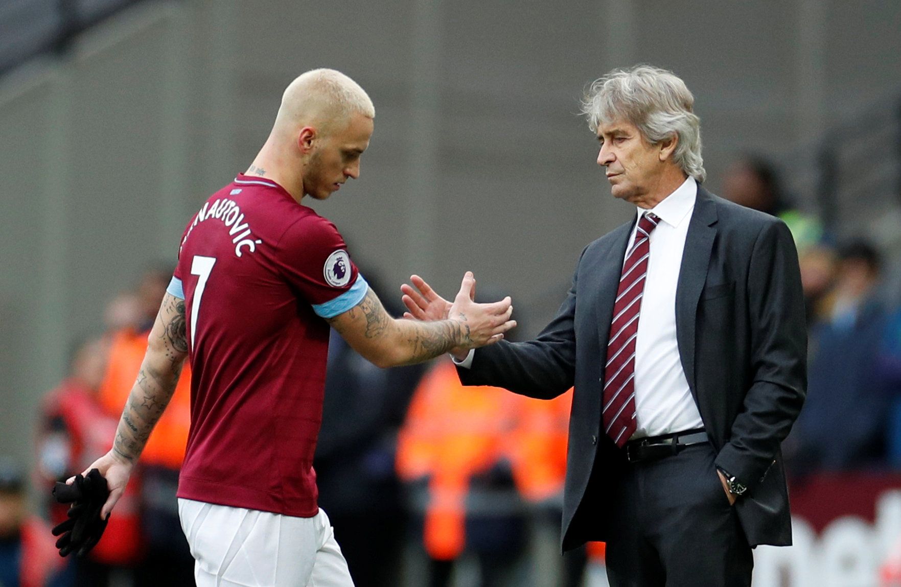 Soccer Football - Premier League - West Ham United v Arsenal - London Stadium, London, Britain - January 12, 2019  West Ham's Marko Arnautovic is substituted and shakes hands with manager Manuel Pellegrini            Action Images via Reuters/John Sibley  EDITORIAL USE ONLY. No use with unauthorized audio, video, data, fixture lists, club/league logos or 