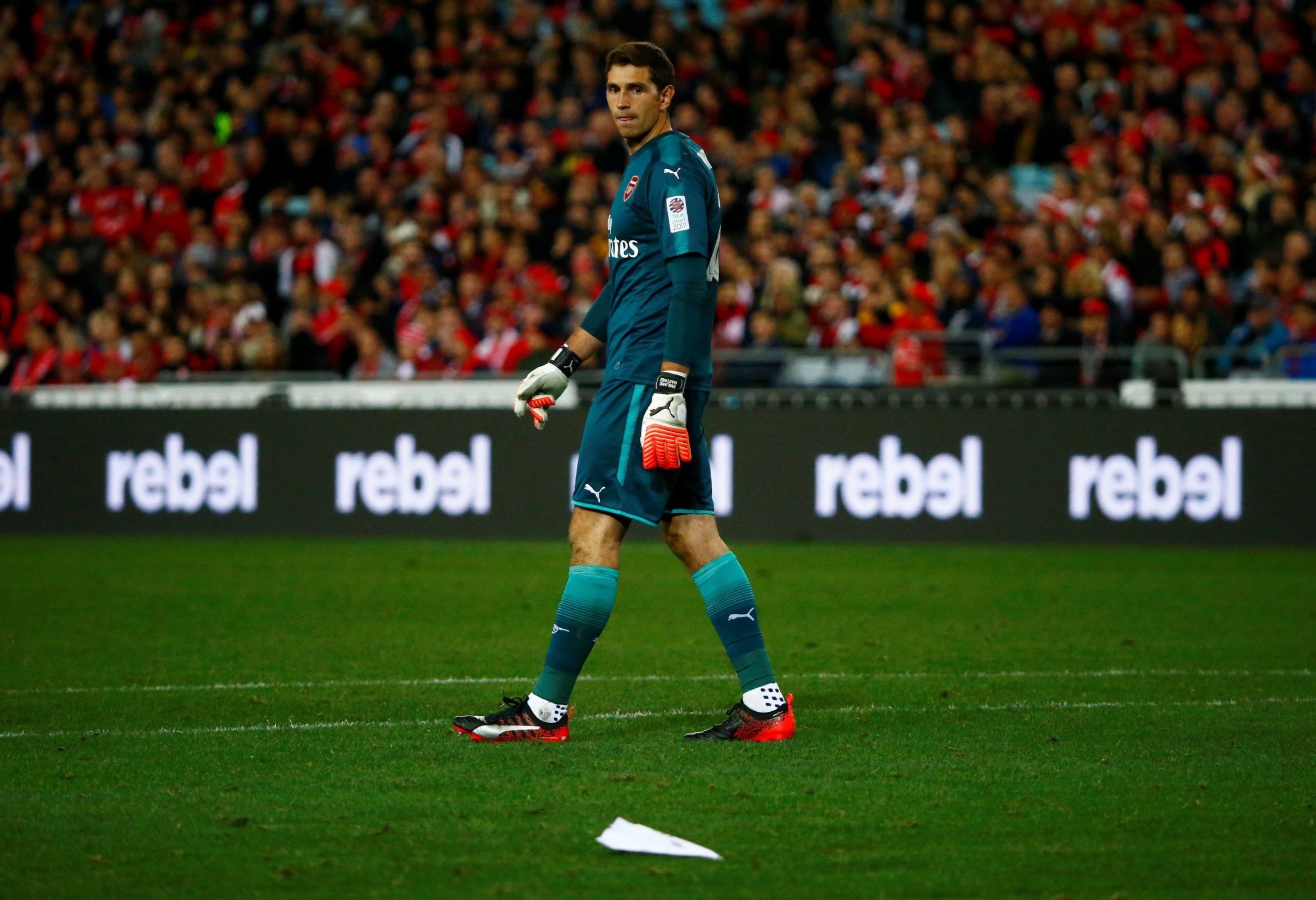 Arsenal's Emiliano Martinez and a paper plane on the pitch in pre-season friendly v Western Sydney Wanderers