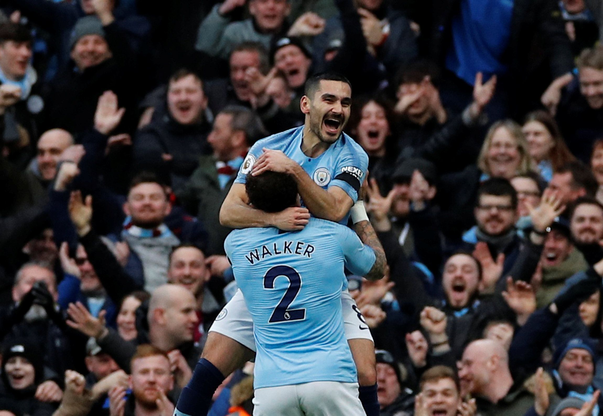 Soccer Football - Premier League - Manchester City v Chelsea - Etihad Stadium, Manchester, Britain - February 10, 2019  Manchester City's Ilkay Gundogan celebrates scoring their fourth goal with Kyle Walker                 REUTERS/Phil Noble  EDITORIAL USE ONLY. No use with unauthorized audio, video, data, fixture lists, club/league logos or 