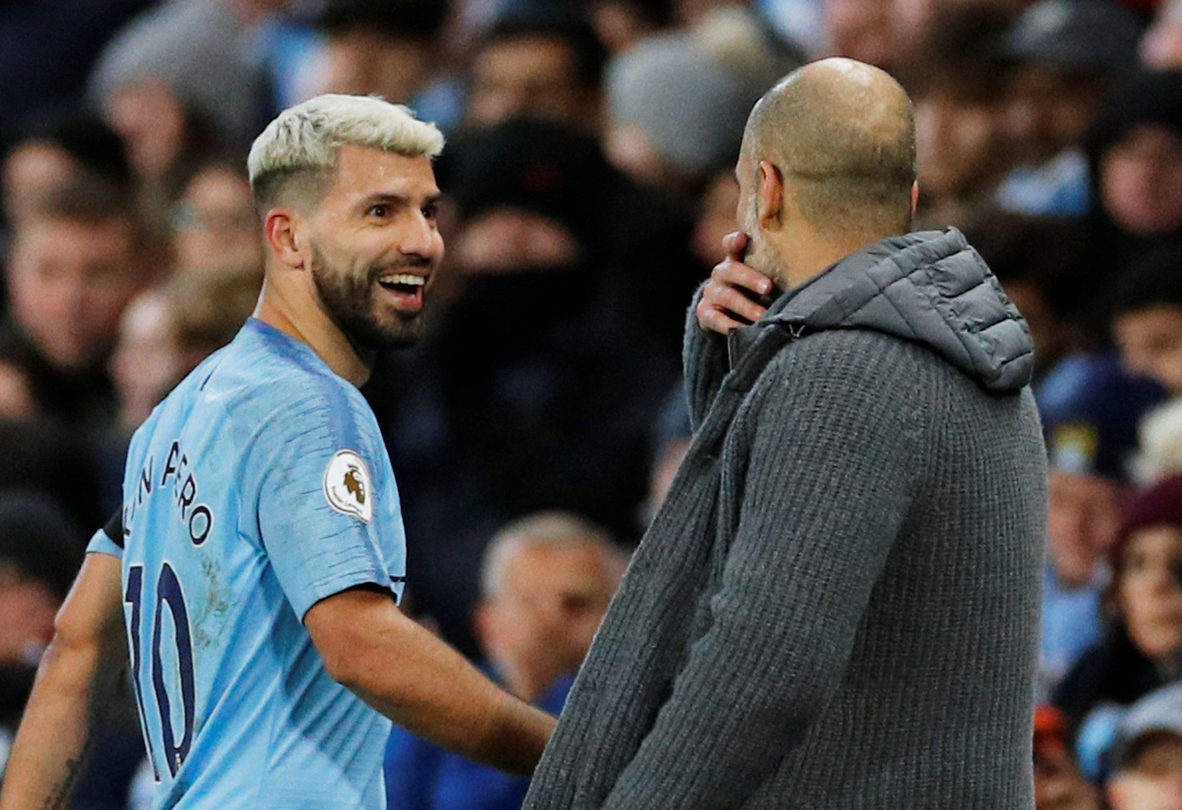 Soccer Football - Premier League - Manchester City v Chelsea - Etihad Stadium, Manchester, Britain - February 10, 2019  Manchester City's Sergio Aguero is substituted and speaks with manager Pep Guardiola            REUTERS/Phil Noble  EDITORIAL USE ONLY. No use with unauthorized audio, video, data, fixture lists, club/league logos or 