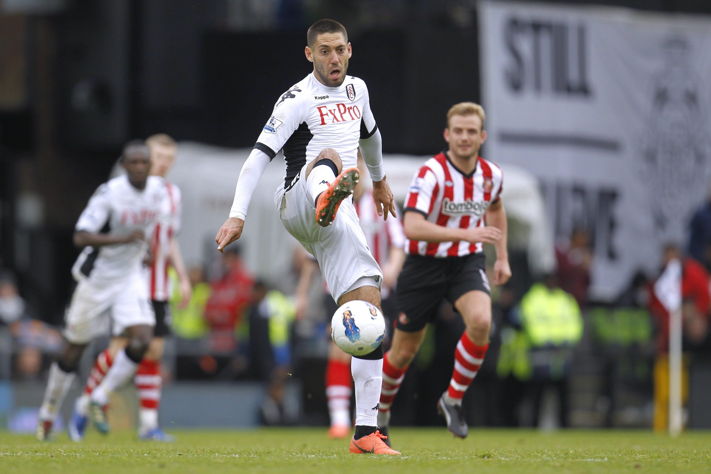 Fulham's Clint Dempsey controls the ball