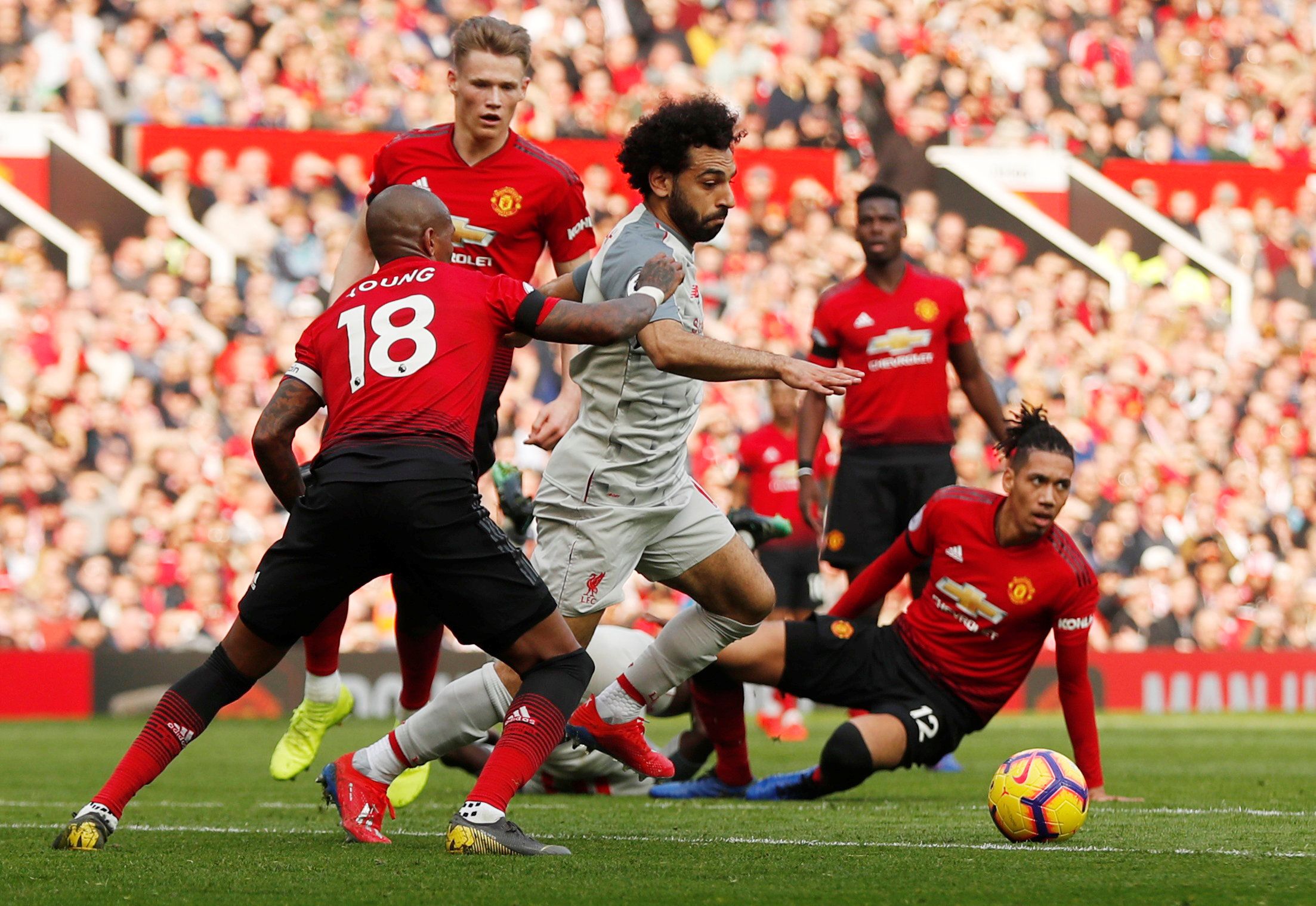 Soccer Football - Premier League - Manchester United v Liverpool - Old Trafford, Manchester, Britain - February 24, 2019  Liverpool's Mohamed Salah in action with Manchester United's Ashley Young   Action Images via Reuters/Lee Smith  EDITORIAL USE ONLY. No use with unauthorized audio, video, data, fixture lists, club/league logos or 