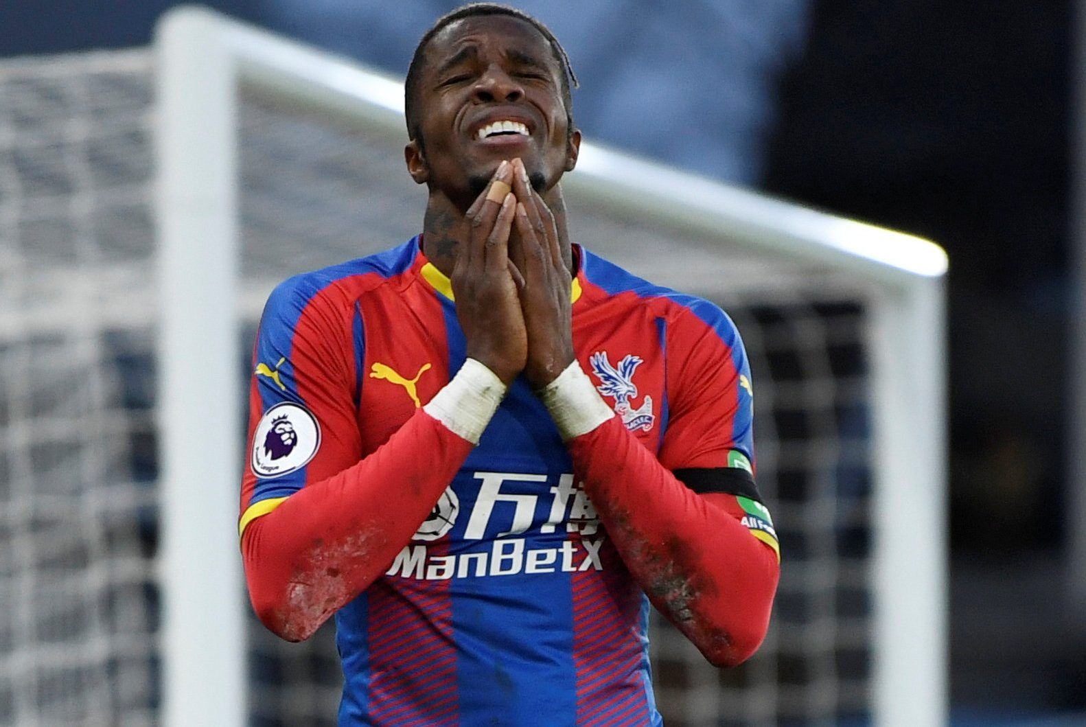 Soccer Football - Premier League - Crystal Palace v West Ham United - Selhurst Park, London, Britain - February 9, 2019  Crystal Palace's Wilfried Zaha reacts after a missed chance      Action Images via Reuters/Tony O'Brien  EDITORIAL USE ONLY. No use with unauthorized audio, video, data, fixture lists, club/league logos or 