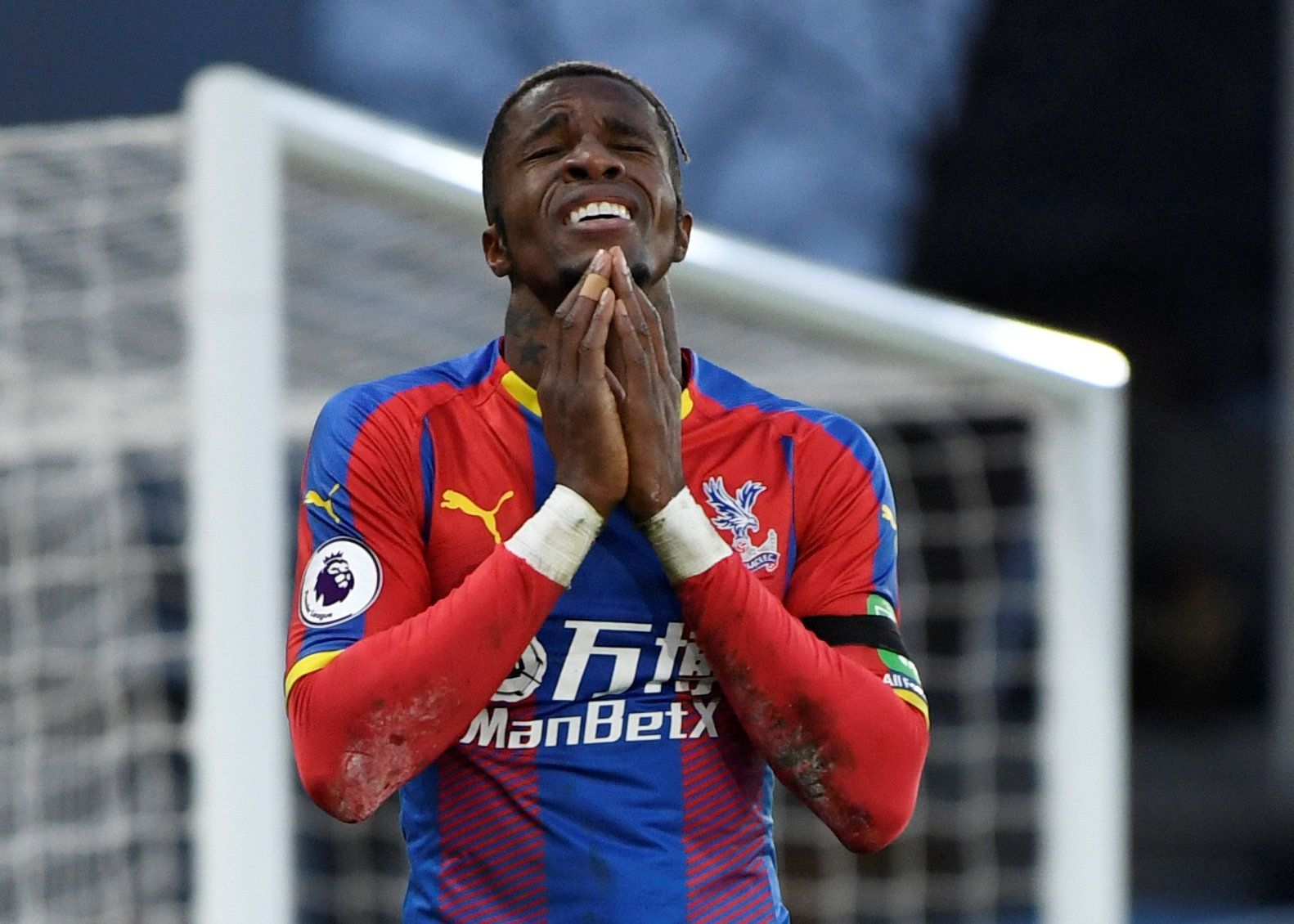Soccer Football - Premier League - Crystal Palace v West Ham United - Selhurst Park, London, Britain - February 9, 2019  Crystal Palace's Wilfried Zaha reacts after a missed chance      Action Images via Reuters/Tony O'Brien  EDITORIAL USE ONLY. No use with unauthorized audio, video, data, fixture lists, club/league logos or "live" services. Online in-match use limited to 75 images, no video emulation. No use in betting, games or single club/league/player publications.  Please contact your accou