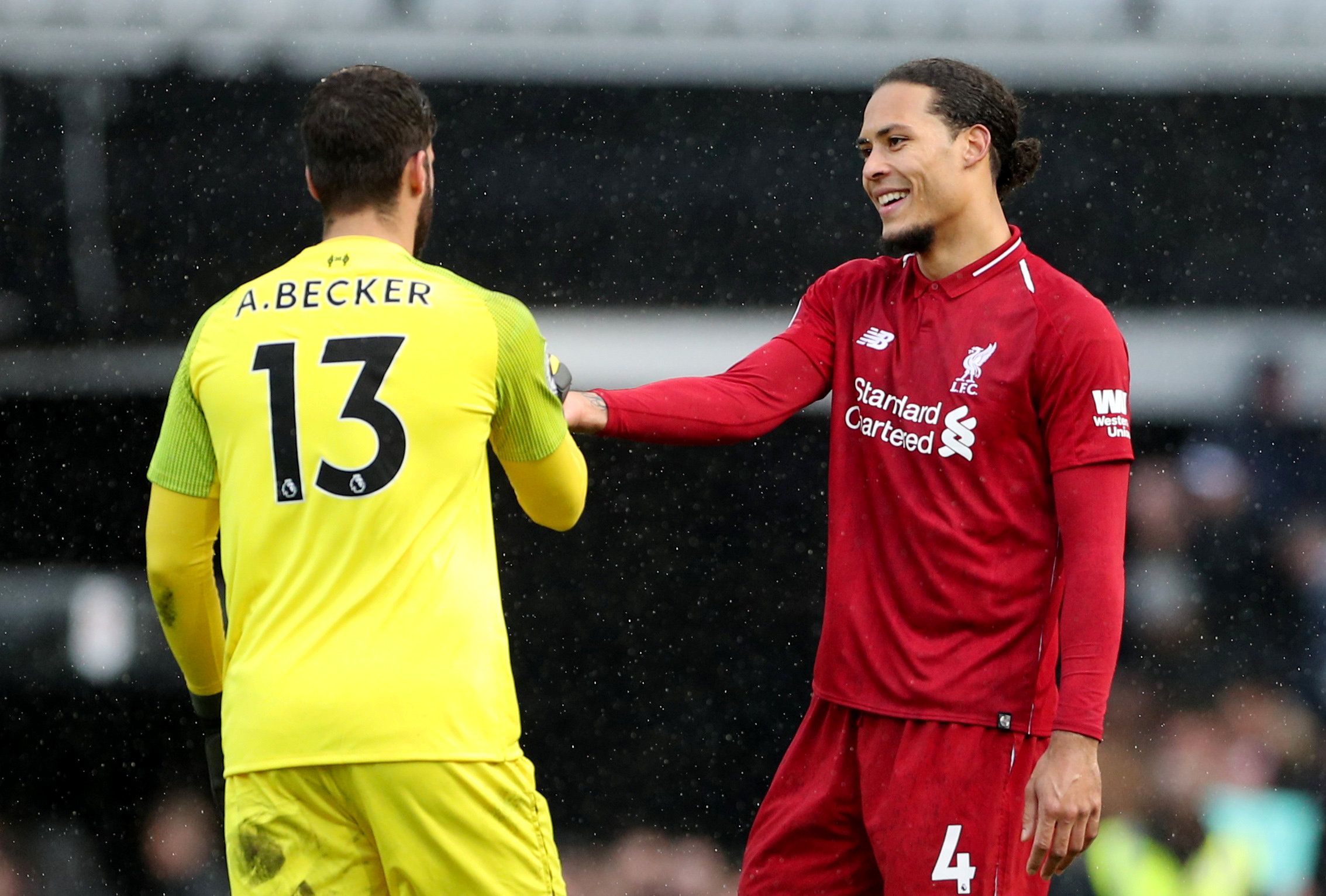 Soccer Football - Premier League - Fulham v Liverpool - Craven Cottage, London, Britain - March 17, 2019  Liverpool's Alisson and Virgil van Dijk celebrate after the match                   REUTERS/Hannah McKay  EDITORIAL USE ONLY. No use with unauthorized audio, video, data, fixture lists, club/league logos or 