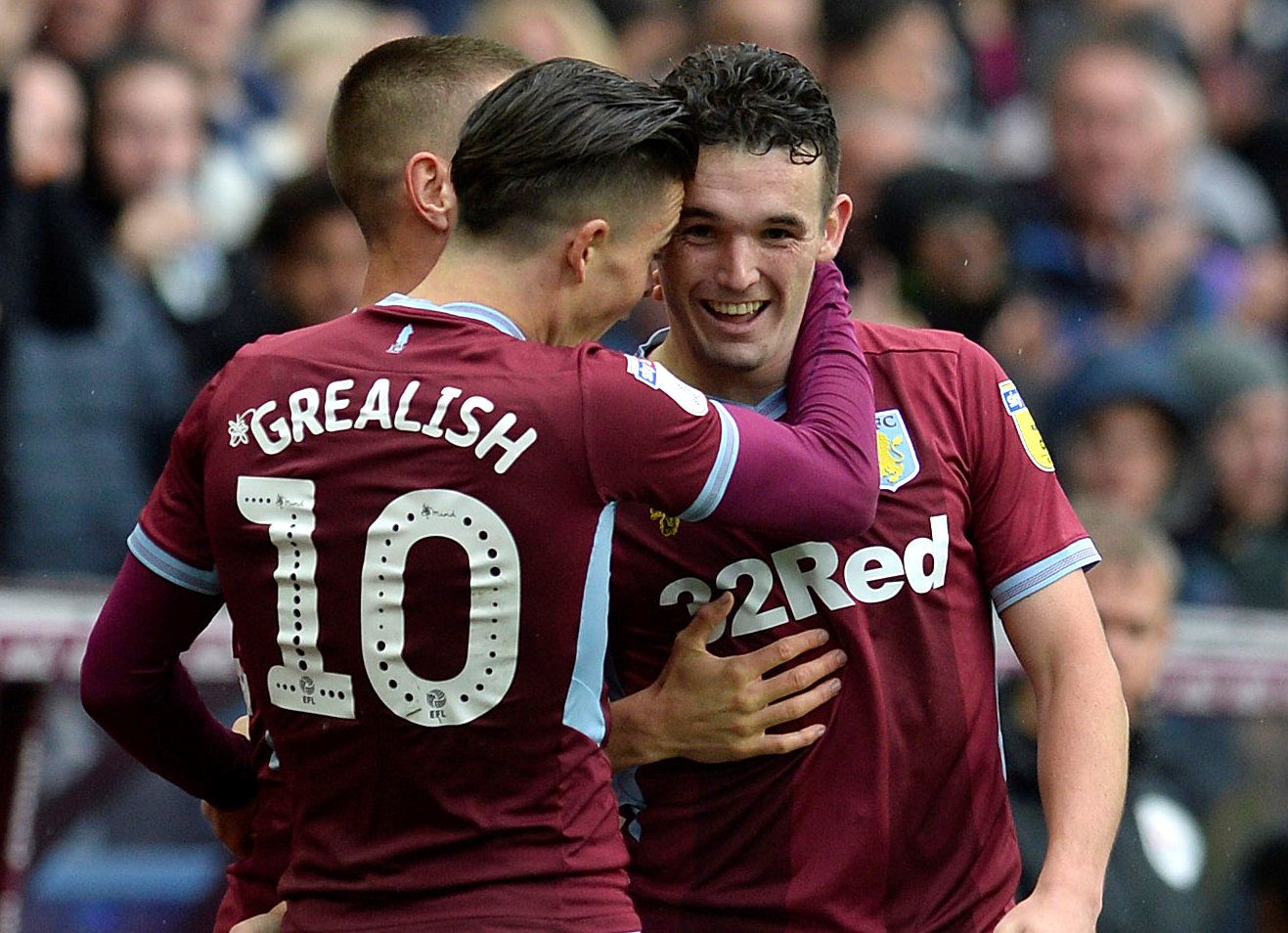 Jack Grealish and John McGinn of Aston Villa embrace. 