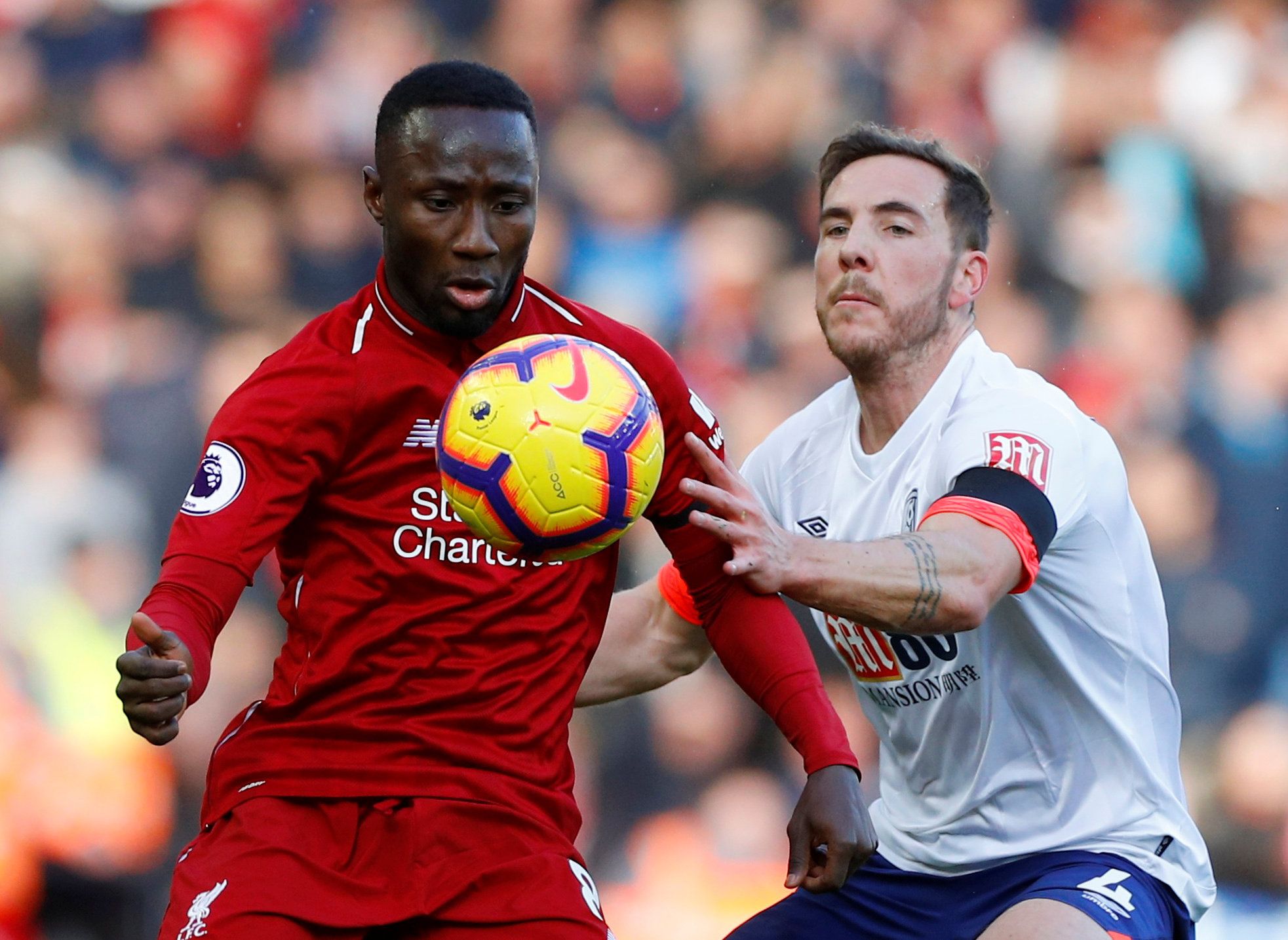 Soccer Football - Premier League - Liverpool v AFC Bournemouth - Anfield, Liverpool, Britain - February 9, 2019  Bournemouth's Dan Gosling in action with Liverpool's Naby Keita     REUTERS/Phil Noble  EDITORIAL USE ONLY. No use with unauthorized audio, video, data, fixture lists, club/league logos or 