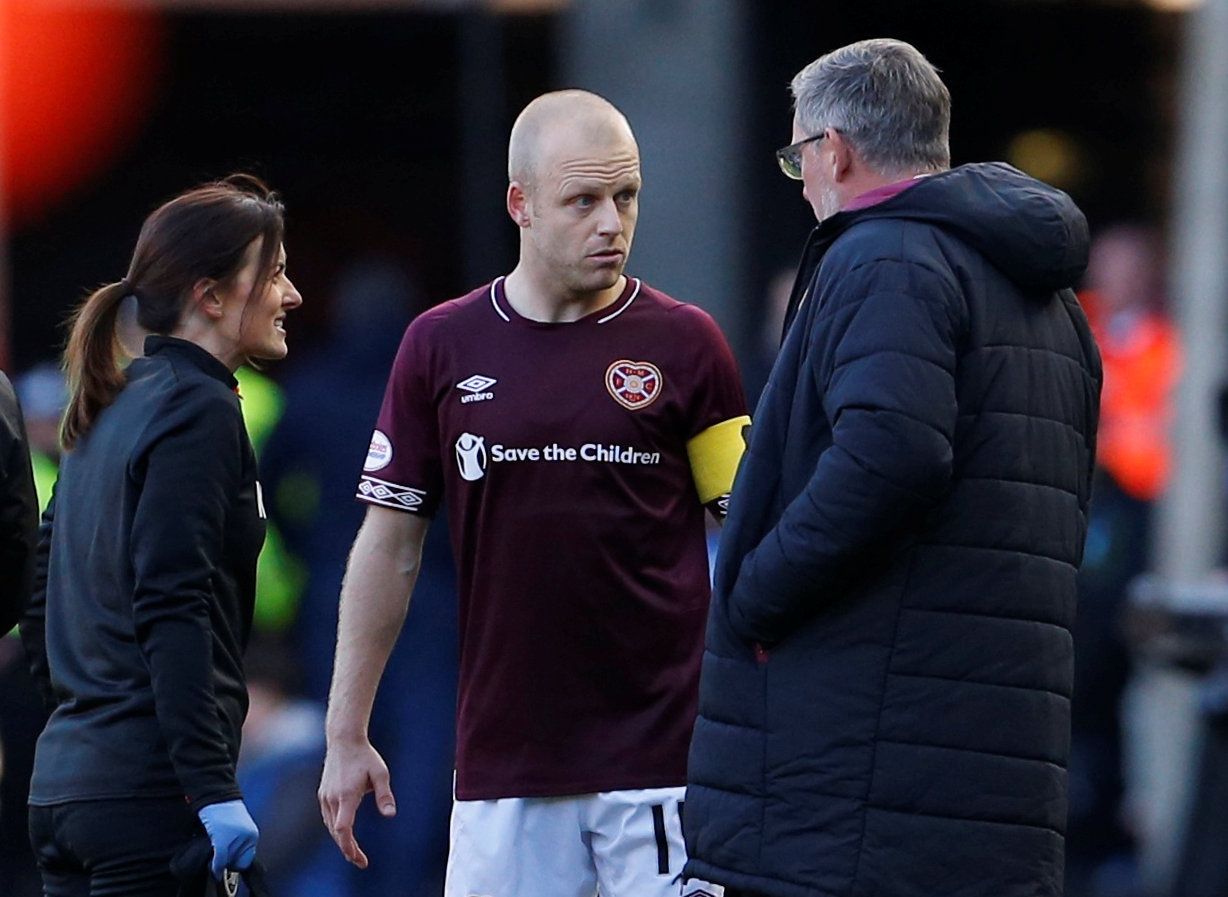 Soccer Football - Scottish League Cup Semi Final - Heart of Midlothian v Celtic - Murrayfield Stadium, Edinburgh, Britain - October 28, 2018  Hearts' Steven Naismith with manager Craig Levein after being substituted off due to injury    Action Images via Reuters/Craig Brough  EDITORIAL USE ONLY. No use with unauthorized audio, video, data, fixture lists, club/league logos or 
