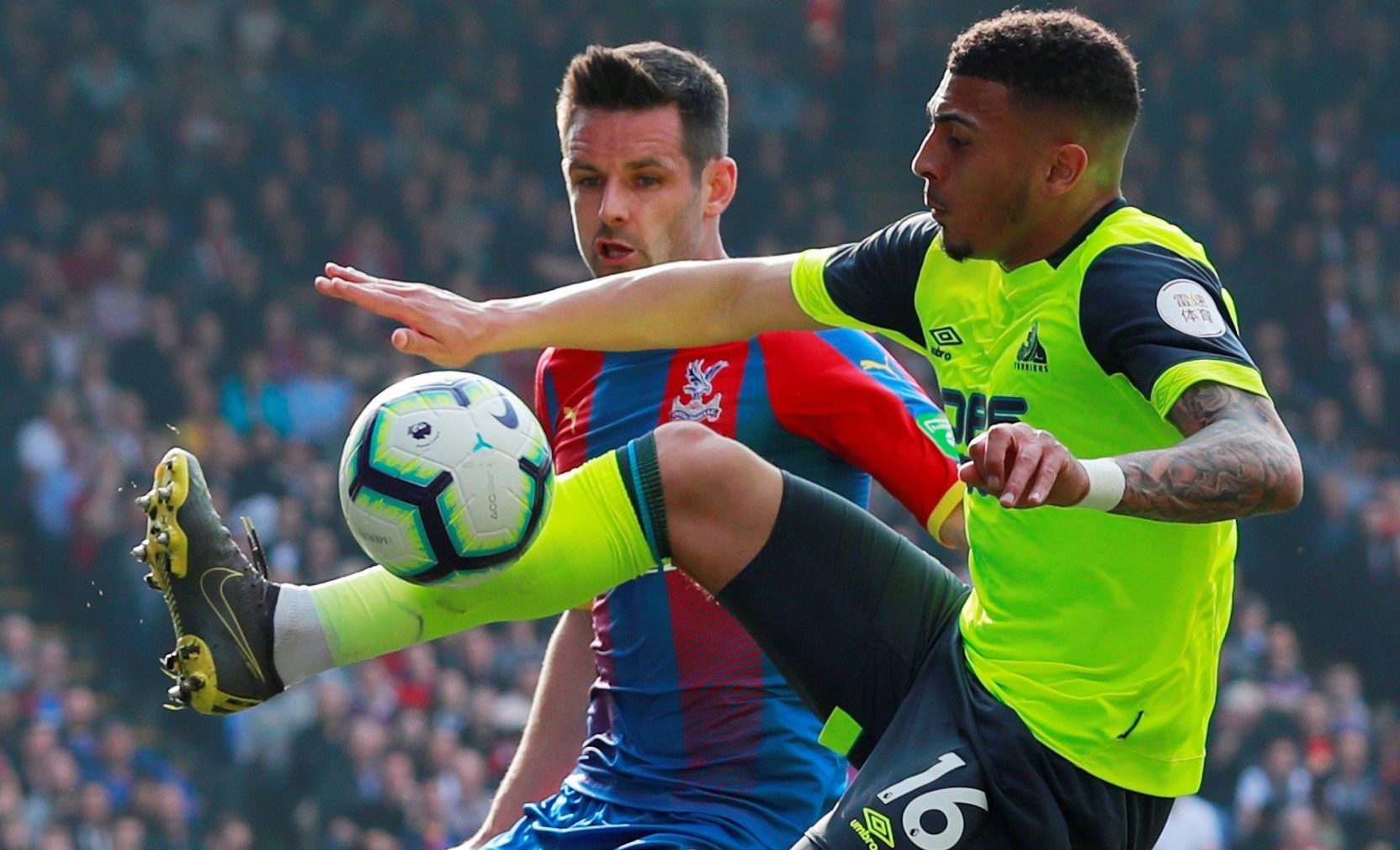 Soccer Football - Premier League - Crystal Palace v Huddersfield Town - Selhurst Park, London, Britain - March 30, 2019  Huddersfield Town's Karlan Ahearne-Grant in action with Crystal Palace's Scott Dann    Action Images via Reuters/Andrew Couldridge  EDITORIAL USE ONLY. No use with unauthorized audio, video, data, fixture lists, club/league logos or 
