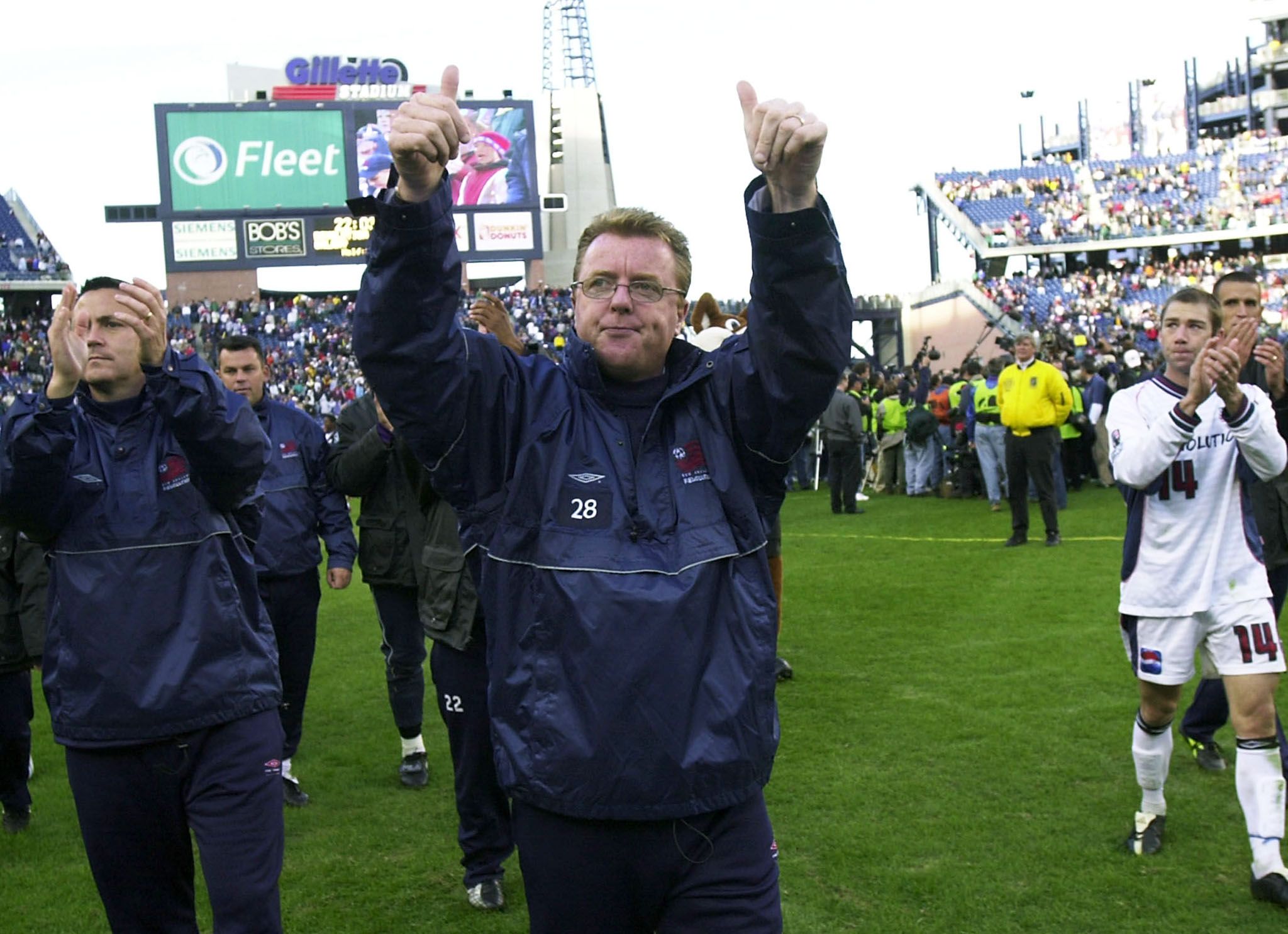 New England Revolution's interim head coach Steve Nicol (C) signals to
the crowd following the Revolution's 1-0 overtime loss to the Los
Angeles Galaxy, in the MLS Soccer Championships in Foxboro
Massachusetts, October 20, 2002. REUTERS/CJ Gunther

CJG/HB