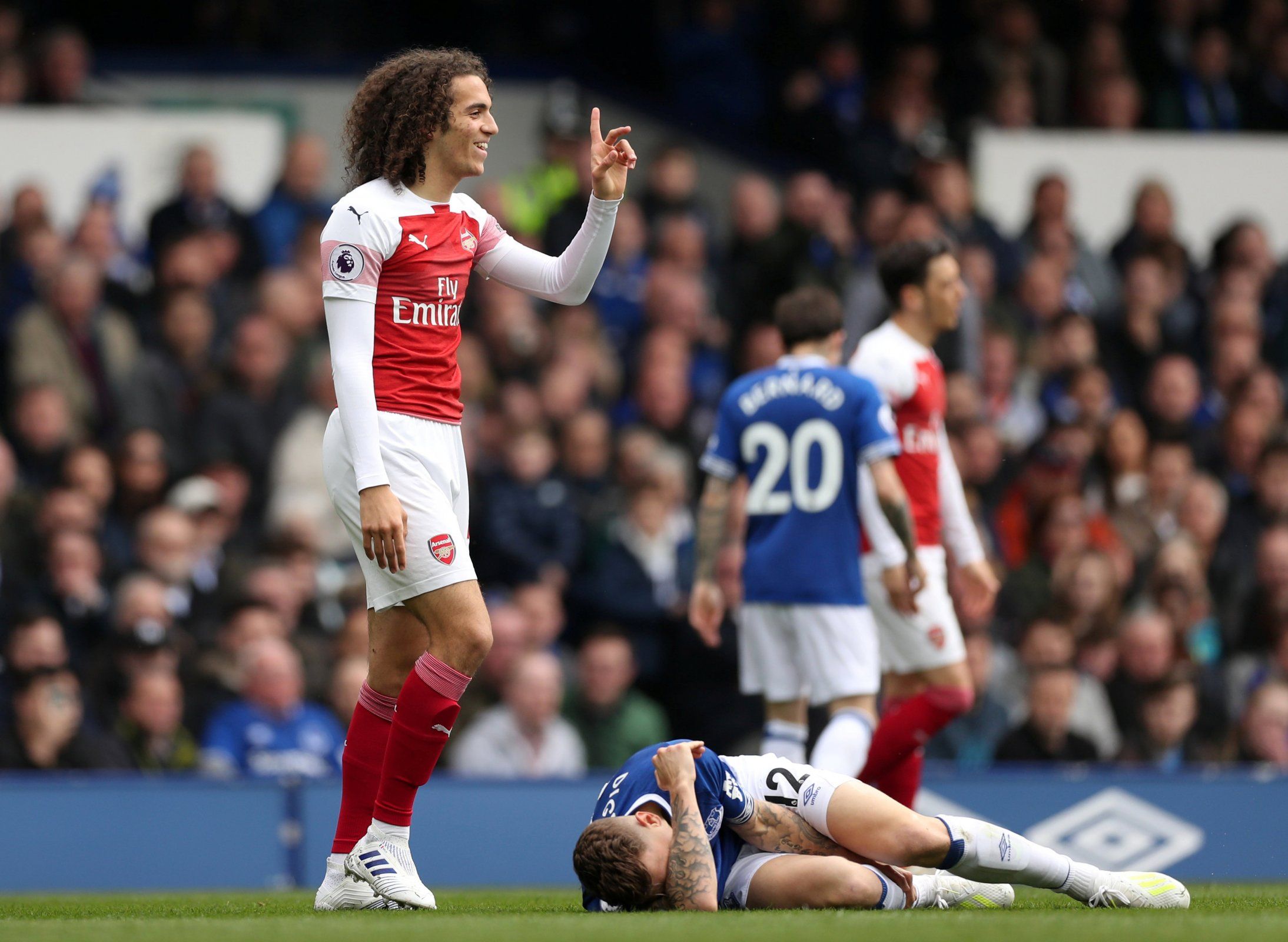 Arsenal midfielder Matteo Guendouzi reacts after being booked vs Everton