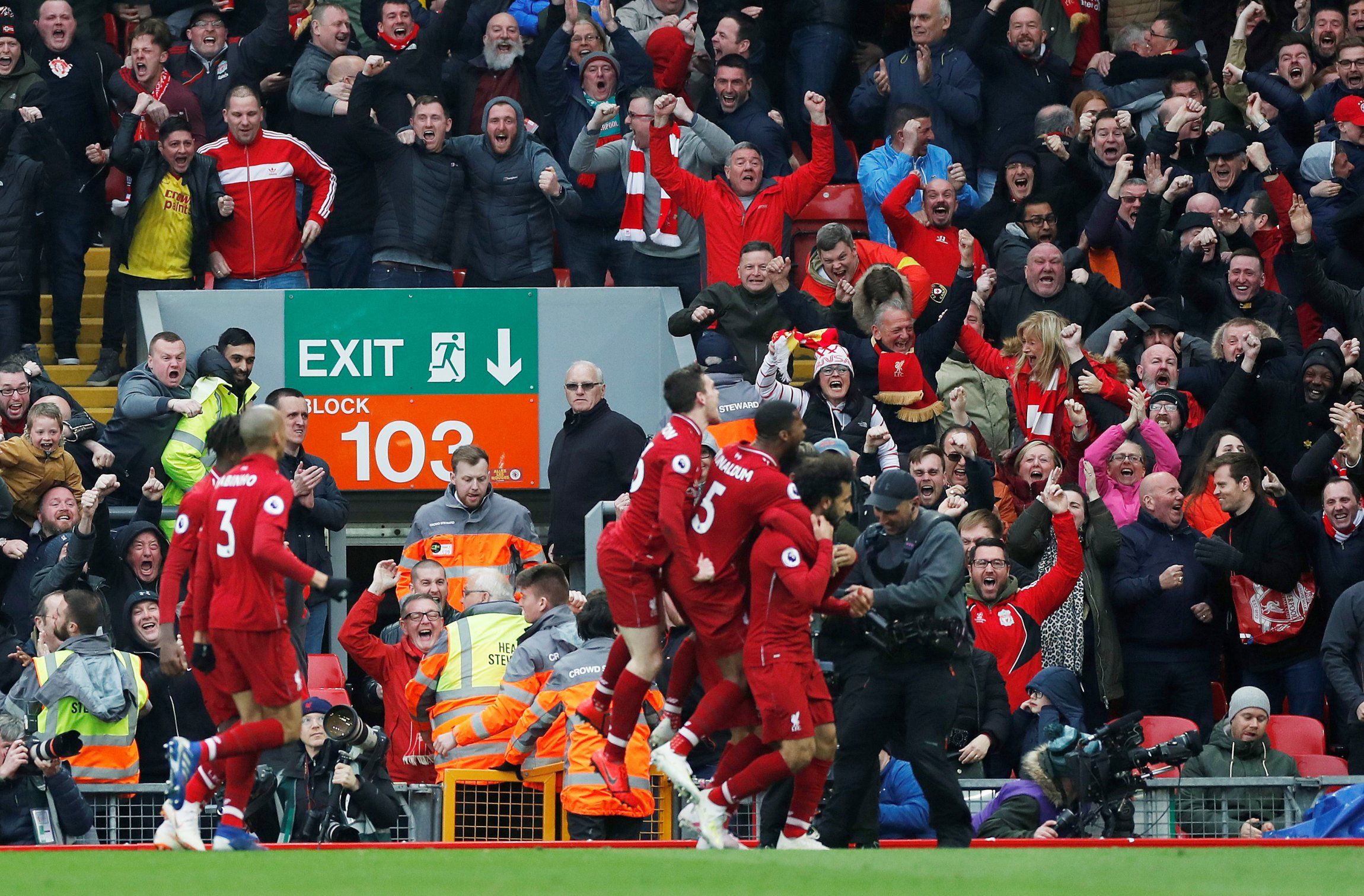 Liverpool fans and players celebrate Mo Salah's late winner vs Tottenham