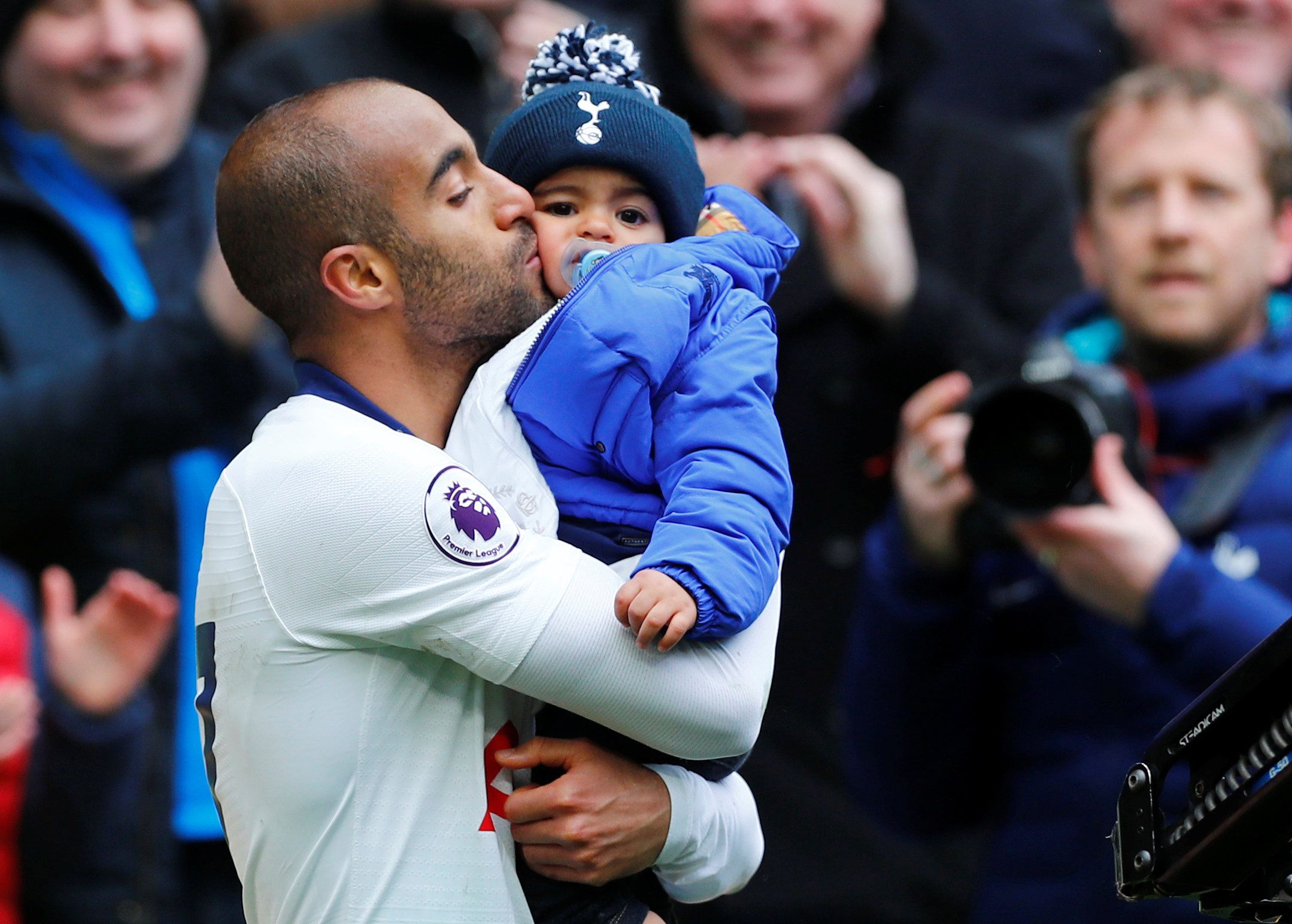 Soccer Football - Premier League - Tottenham Hotspur v Huddersfield Town - Tottenham Hotspur Stadium, London, Britain - April 13, 2019  Tottenham's Lucas Moura celebrates after the match with his son          REUTERS/Eddie Keogh  EDITORIAL USE ONLY. No use with unauthorized audio, video, data, fixture lists, club/league logos or 