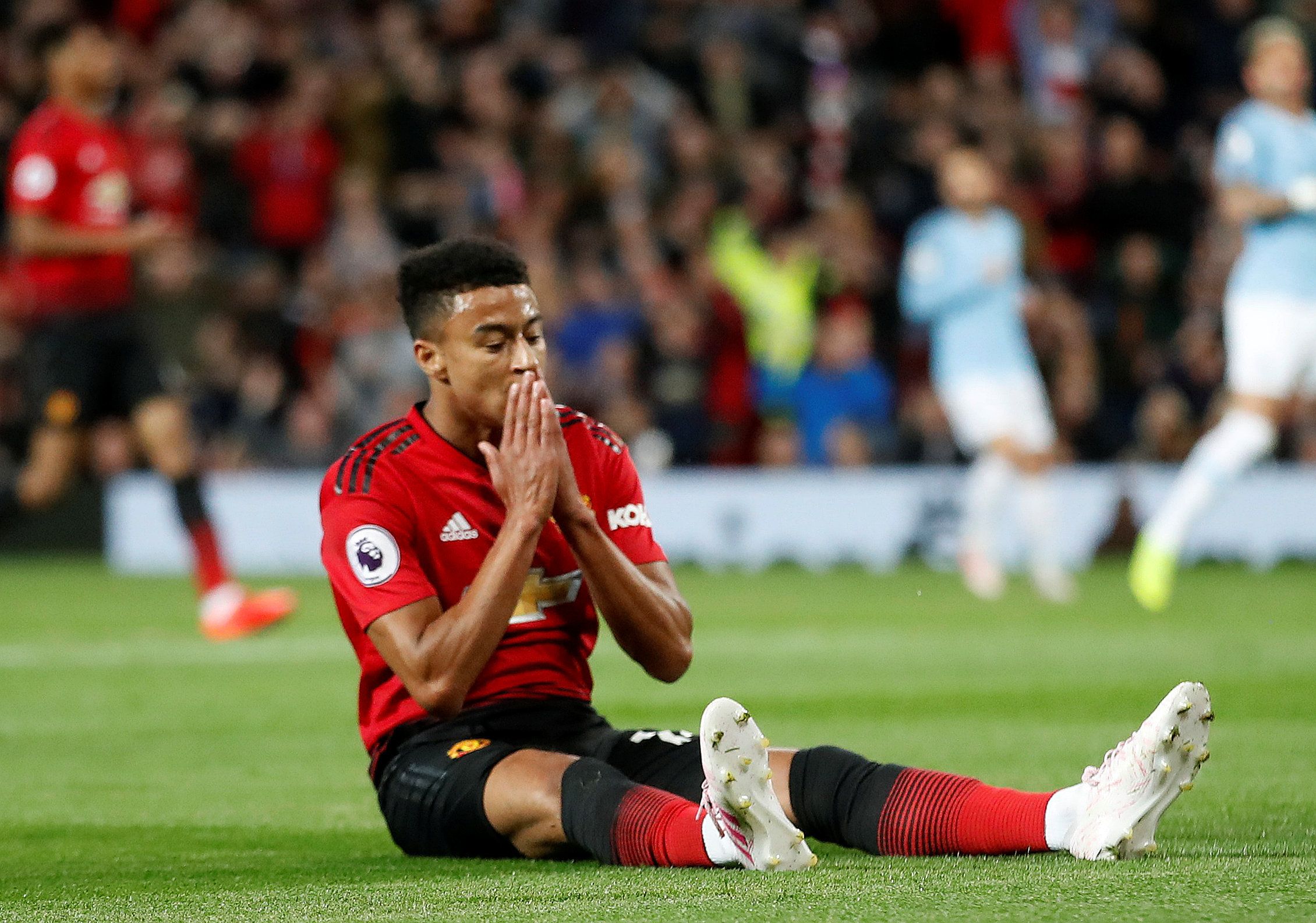 Manchester United attacker Jesse Lingard reacts after missed opportunity vs Manchester City