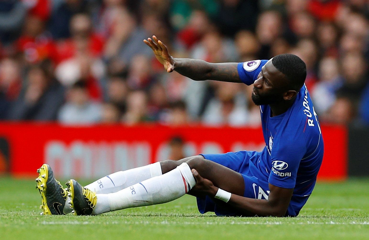 Soccer Football - Premier League - Manchester United v Chelsea - Old Trafford, Manchester, Britain - April 28, 2019  Chelsea's Antonio Rudiger down injured being being substituted      REUTERS/Phil Noble  EDITORIAL USE ONLY. No use with unauthorized audio, video, data, fixture lists, club/league logos or 